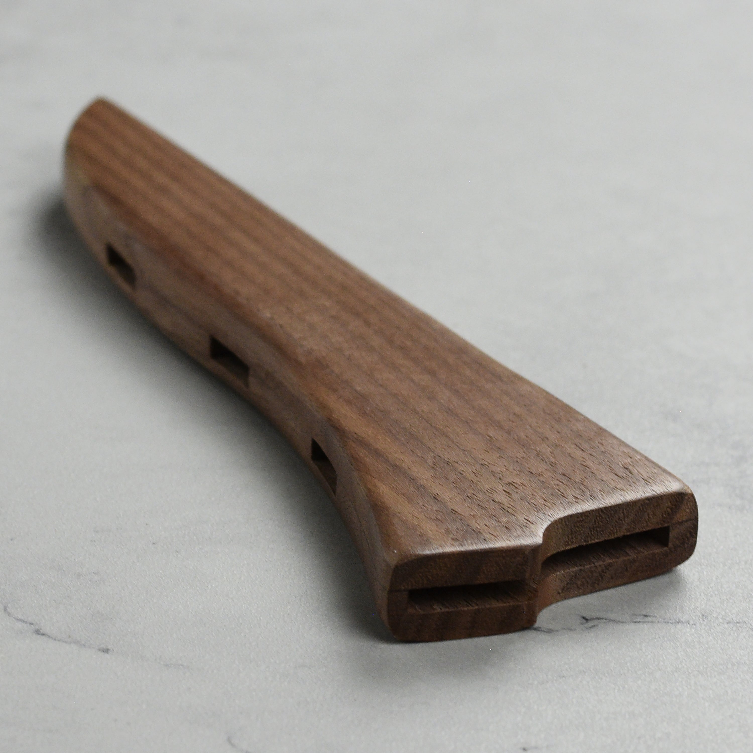 Stylish wooden knife holder with knives displayed safely for professional kitchens