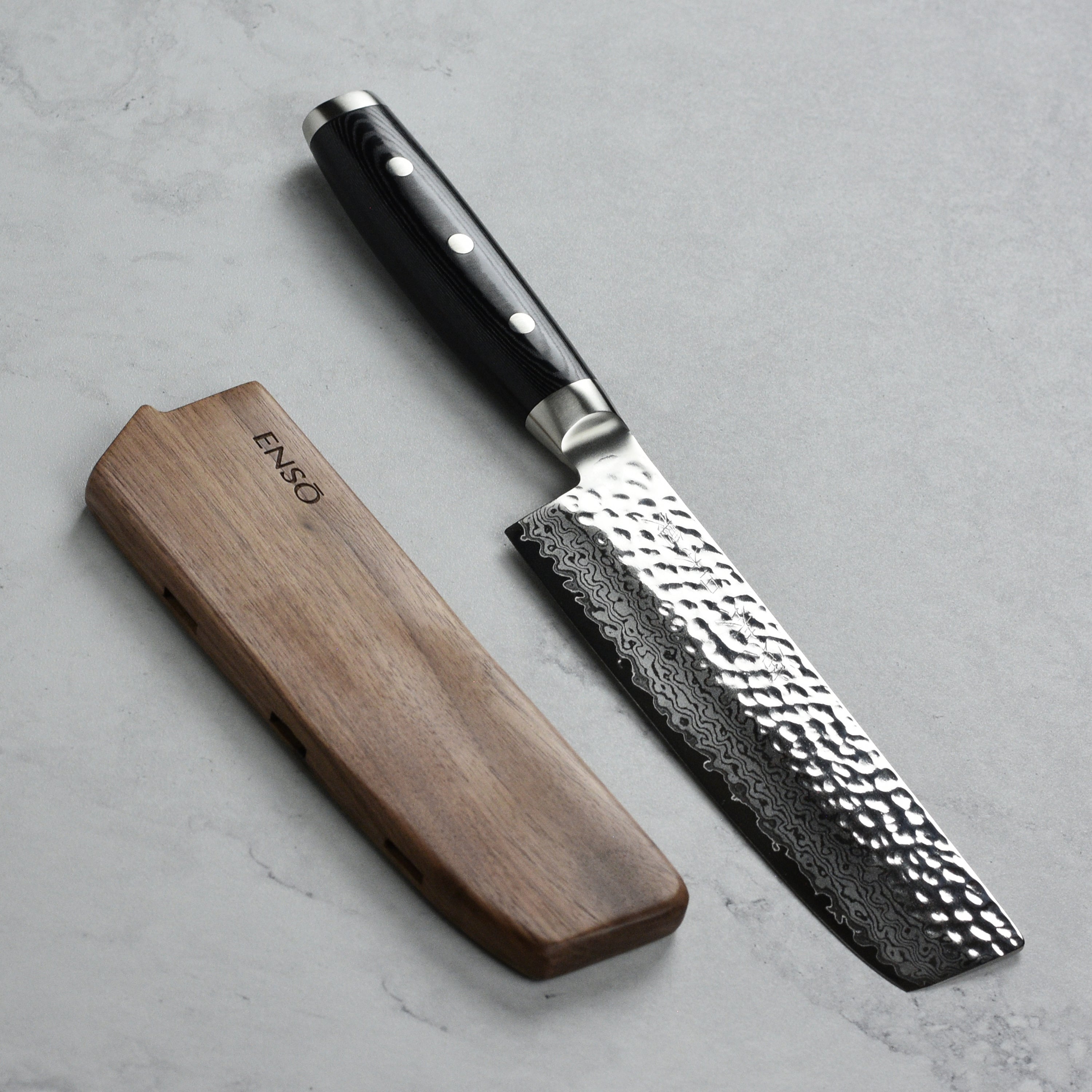 Enso Premium Walnut Magnetic Knife Sheath showcasing its sleek design and strong magnetic grip.