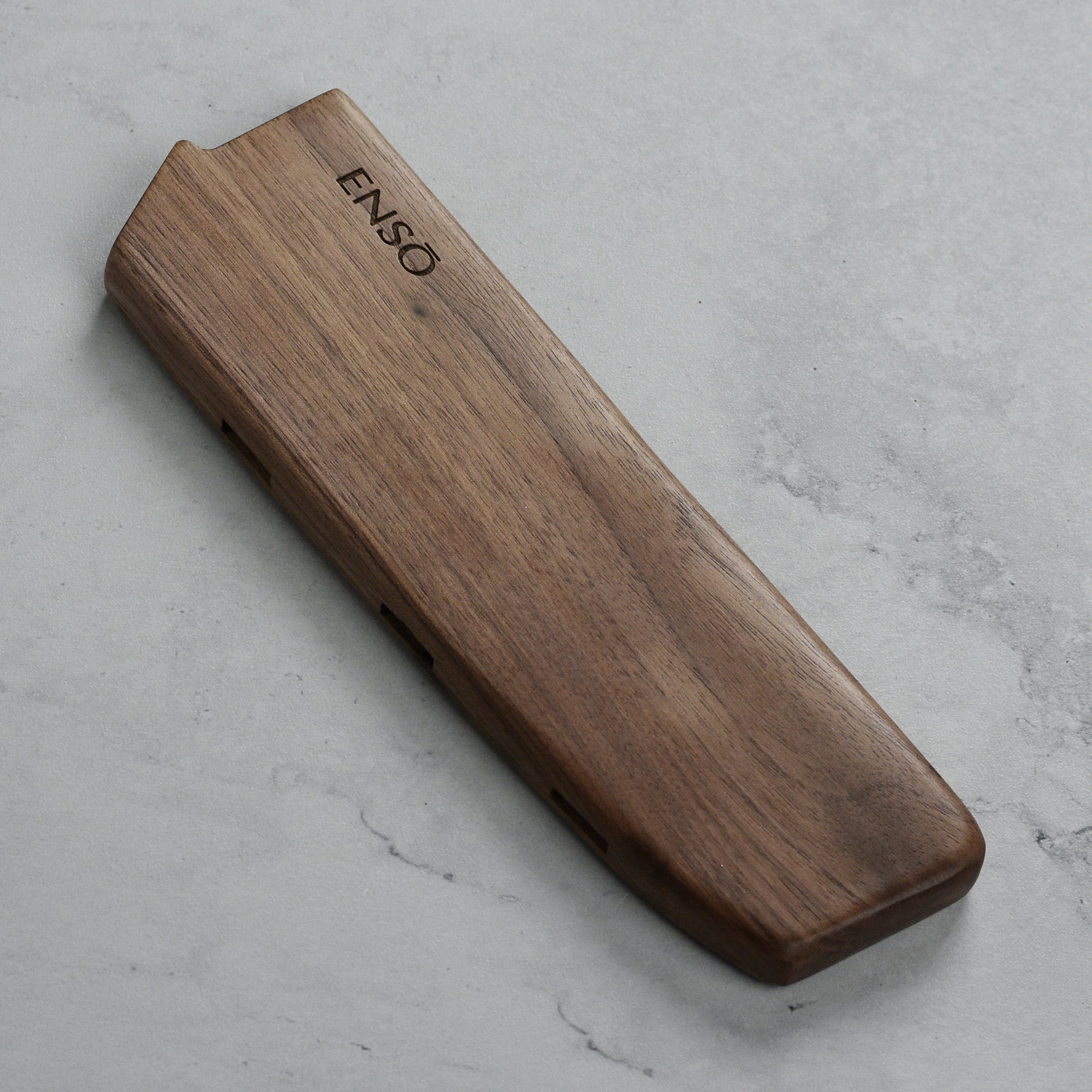 Enso Premium Walnut Magnetic Knife Sheath showcasing its sleek design and strong magnetic grip.