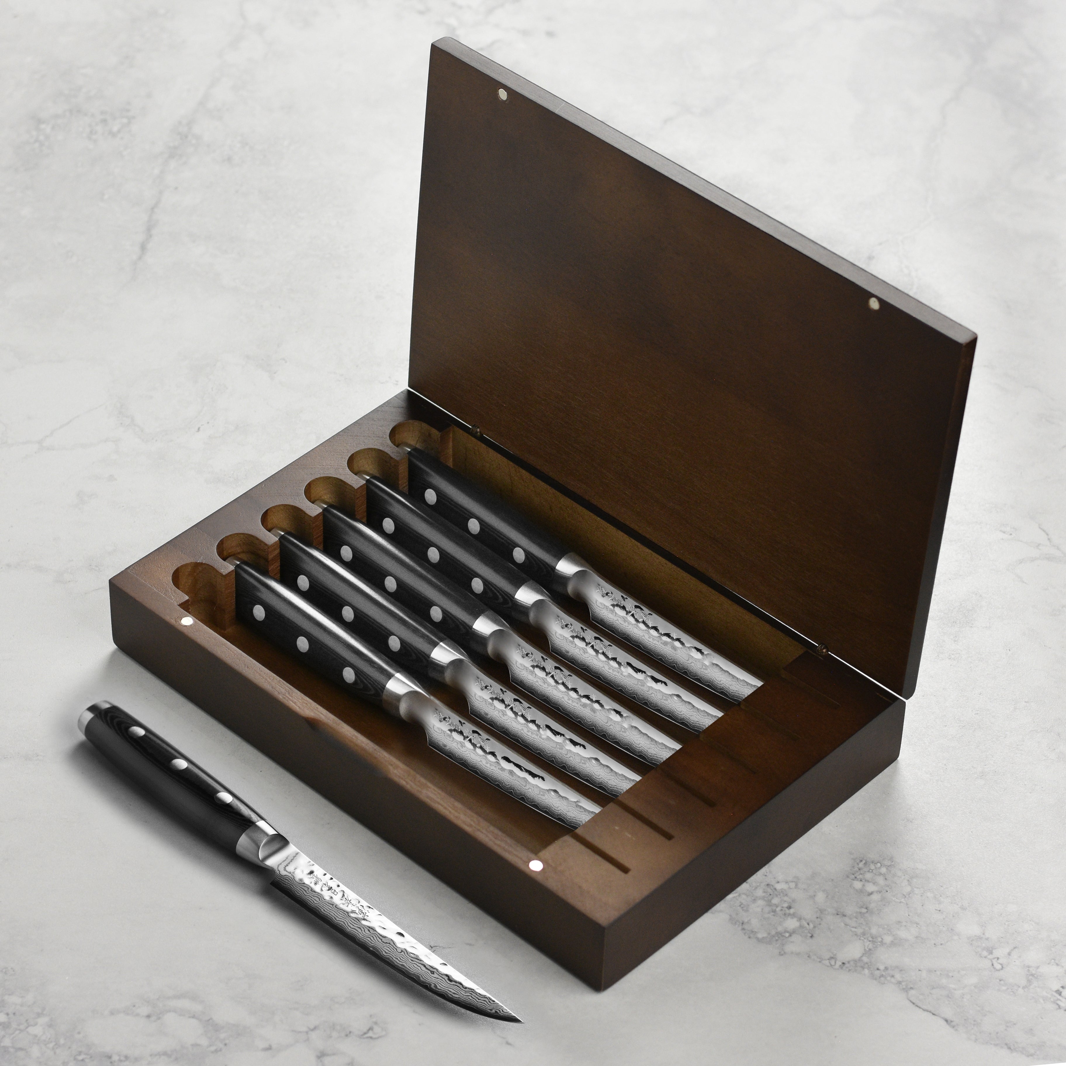 Set of handcrafted Damascus steak knives with hammered finish and elegant handles