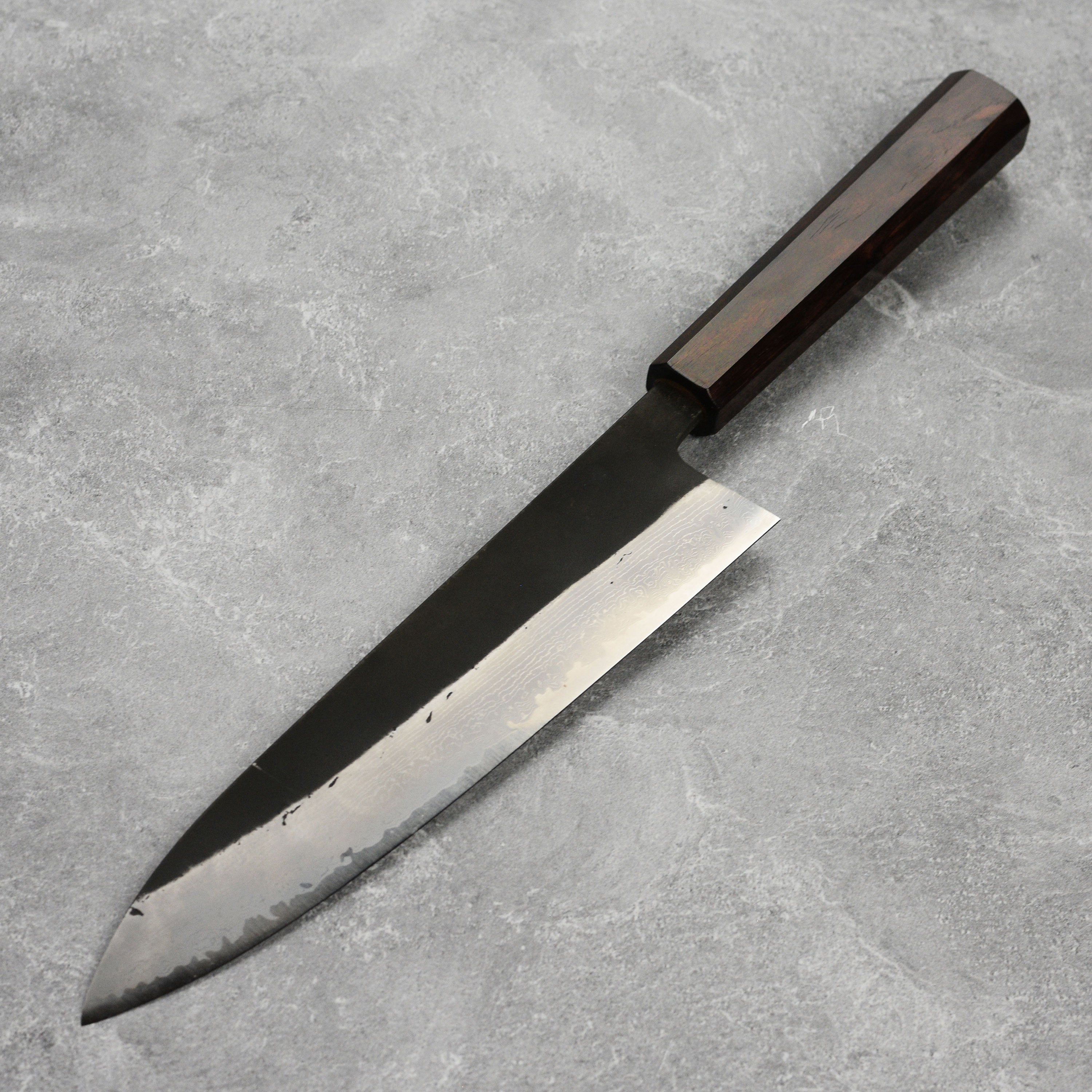 Close-up of the sharp edge and high carbon steel blade of the Gyuto knife