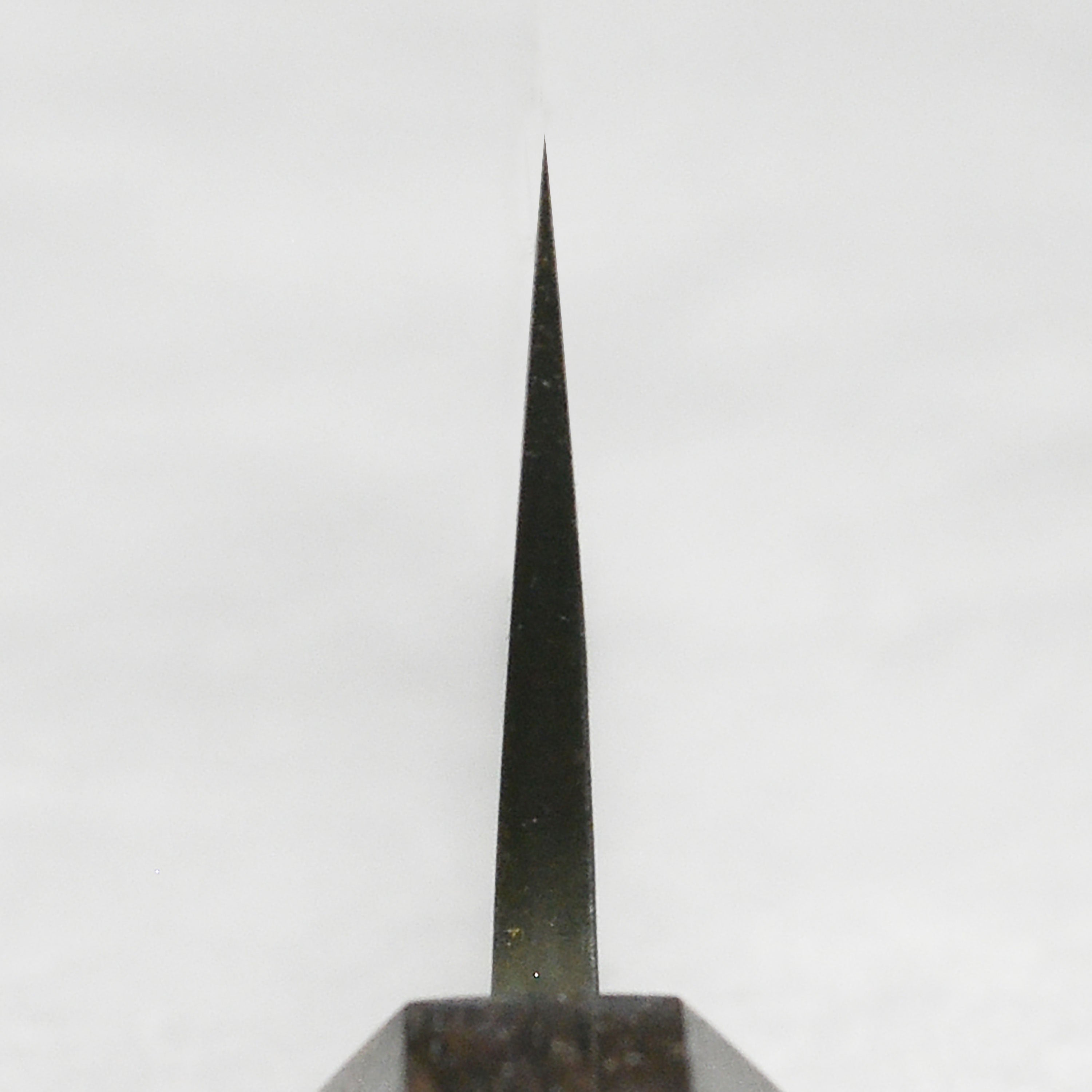 Close-up of the sharp edge and high carbon steel blade of the Gyuto knife