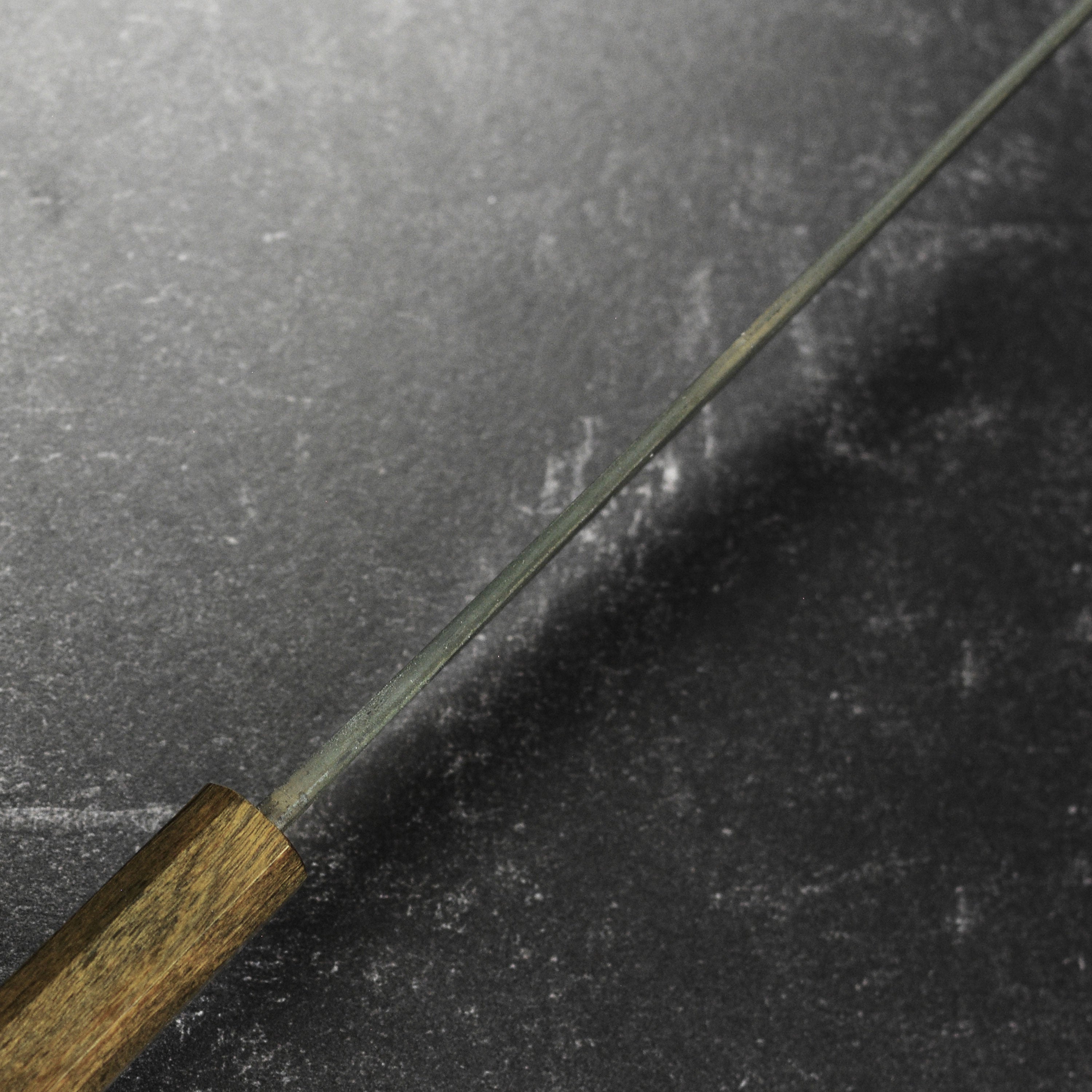 Ergonomic Bubinga handle of the Japanese gyuto knife, designed for comfort and control