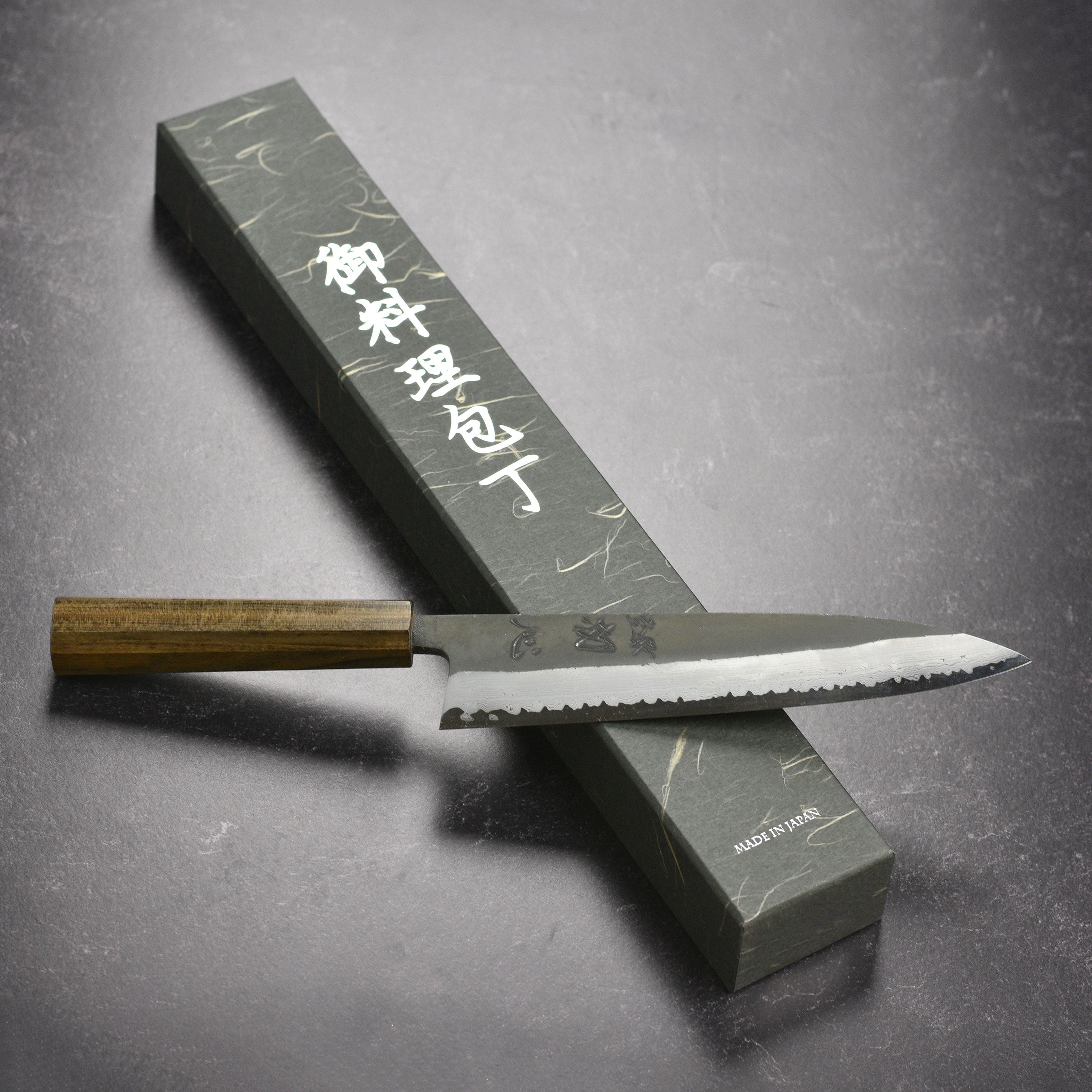 Front view of Hatsukokoro Shinkiro Aogami Super Damascus gyuto with bubinga handle, perfect for slicing and dicing