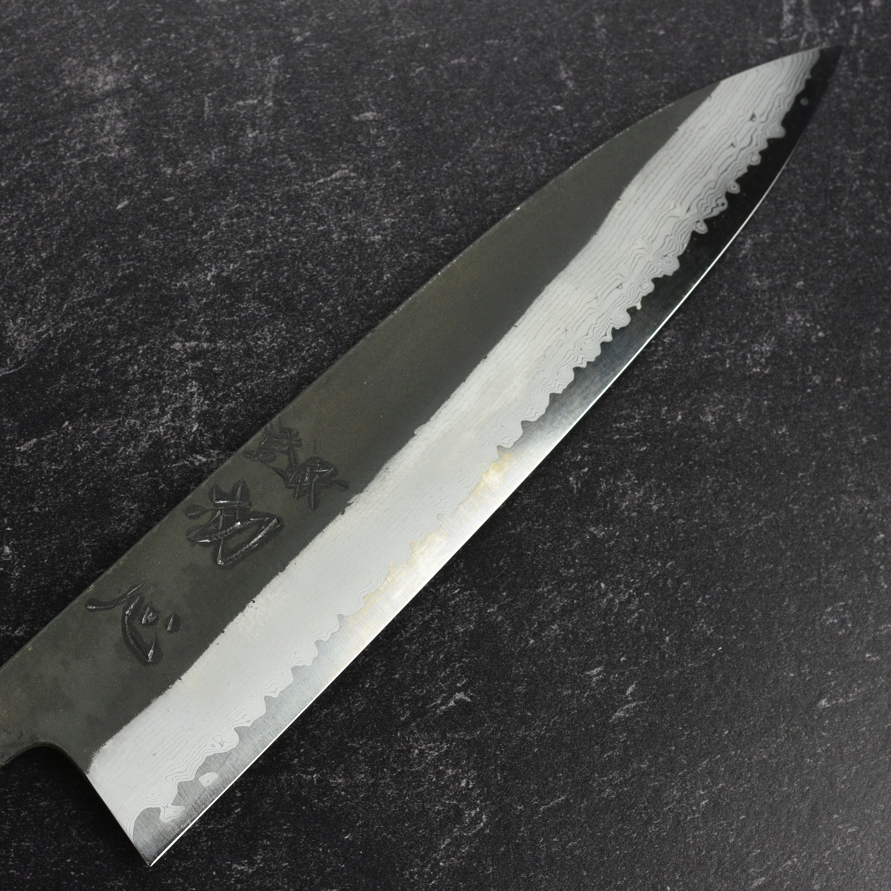 Ergonomic Bubinga handle of the Japanese gyuto knife, designed for comfort and control