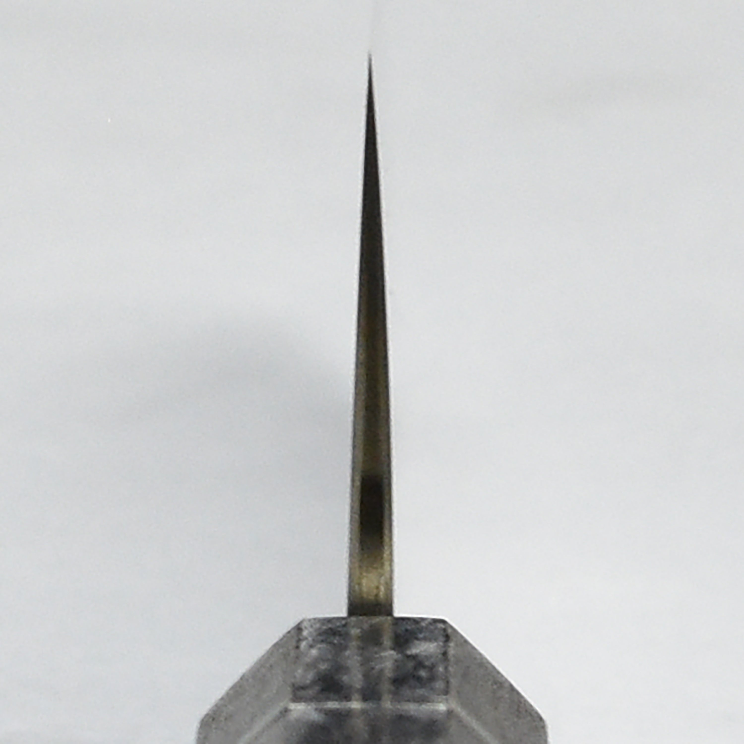 Shiomachi Aogami Gyuto knife displayed on a wooden cutting board, illustrating its elegant design and functionality.