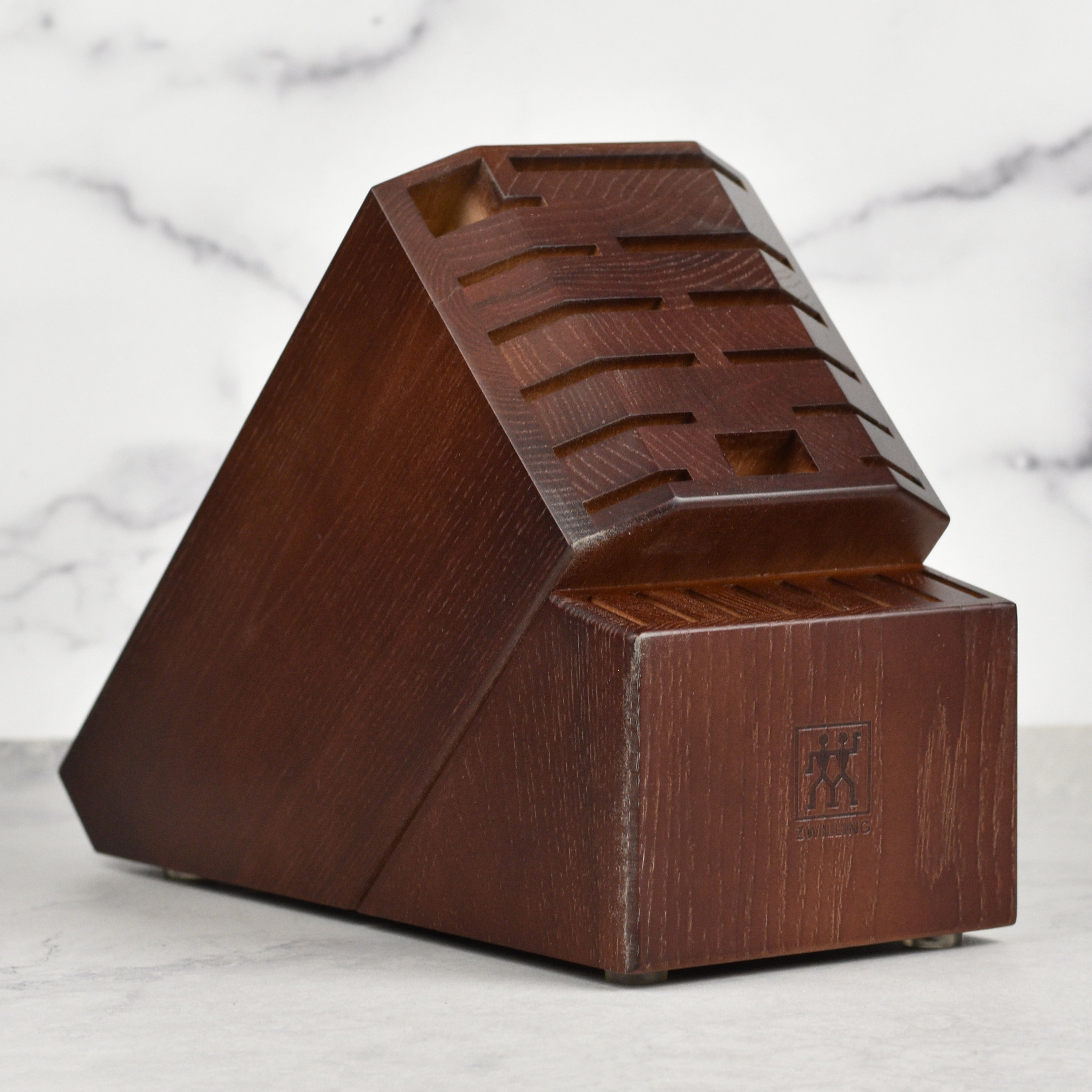 Elegant walnut knife block showcasing its 21 slots for knives and kitchen tools.