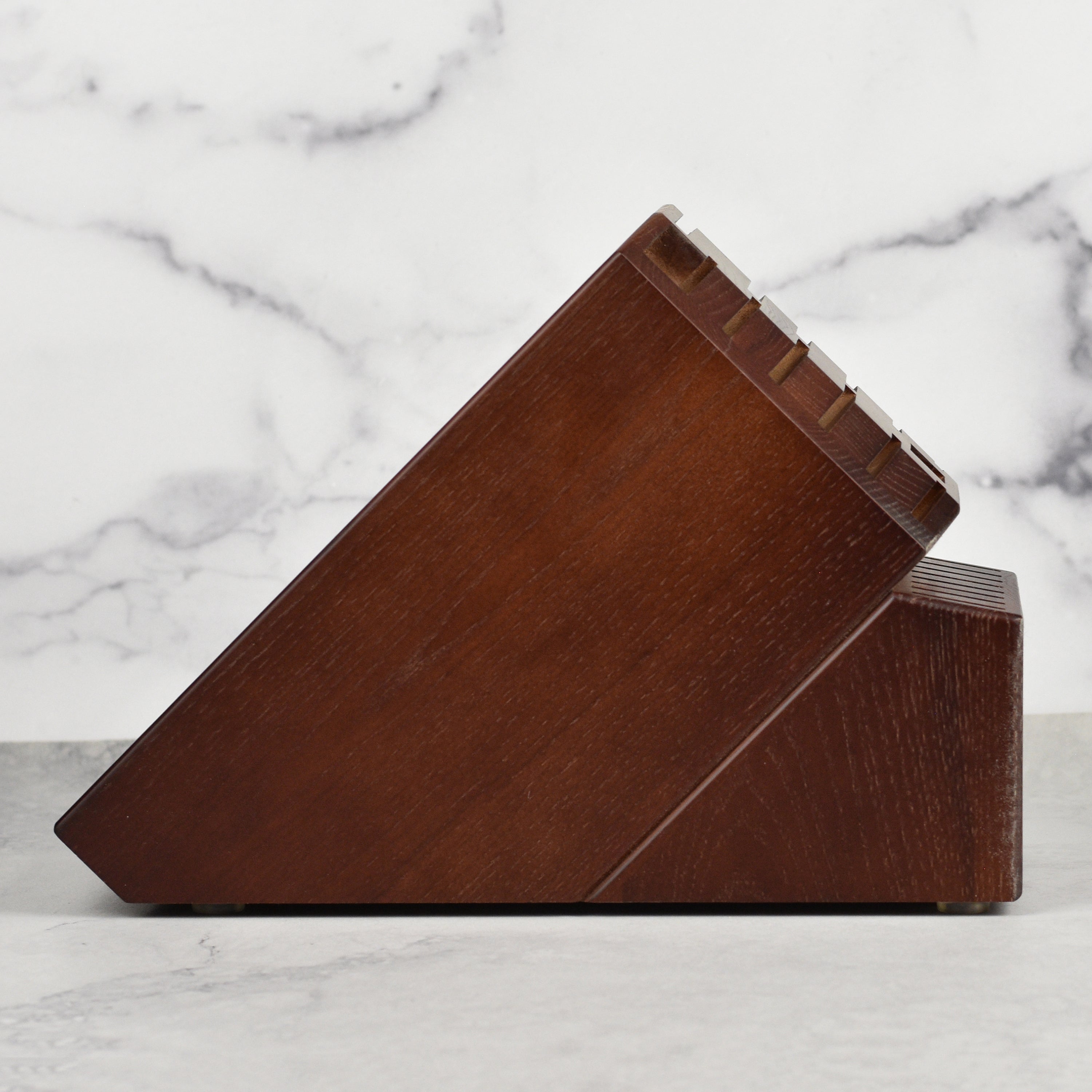 Walnut knife block on a kitchen countertop, demonstrating its stylish and functional design.