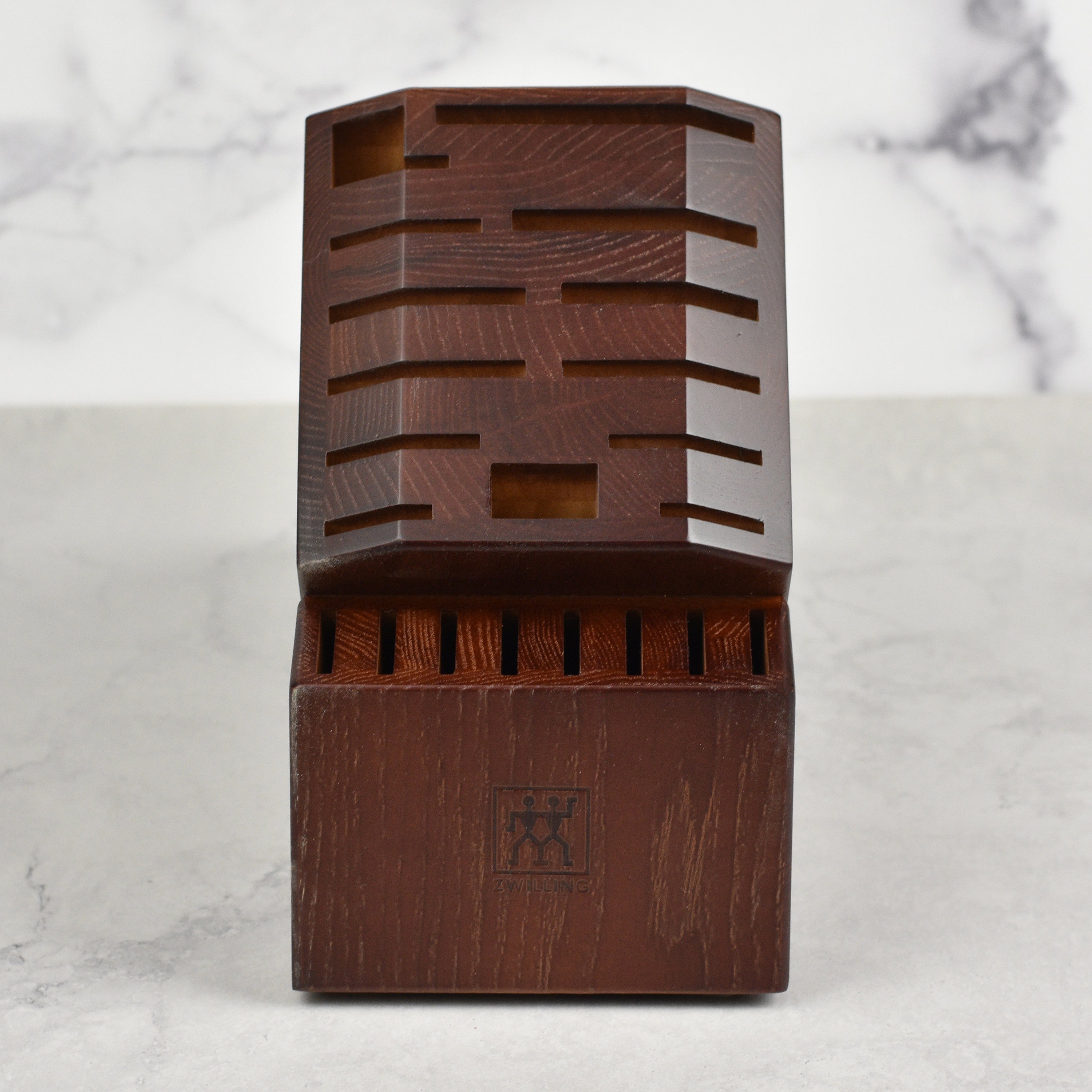 Walnut knife block on a kitchen countertop, demonstrating its stylish and functional design.