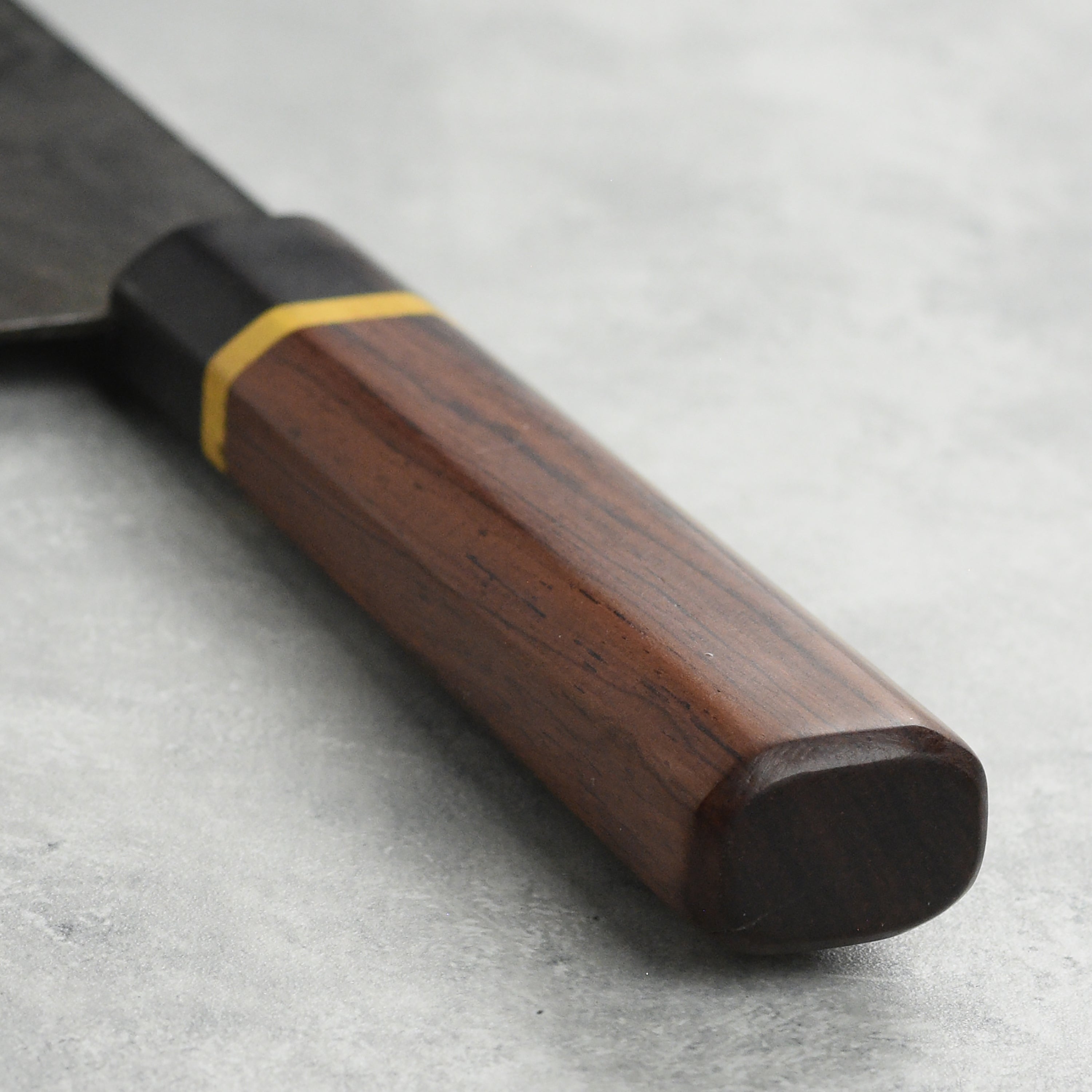Chef using the Chinese cleaver to chop vegetables in the kitchen