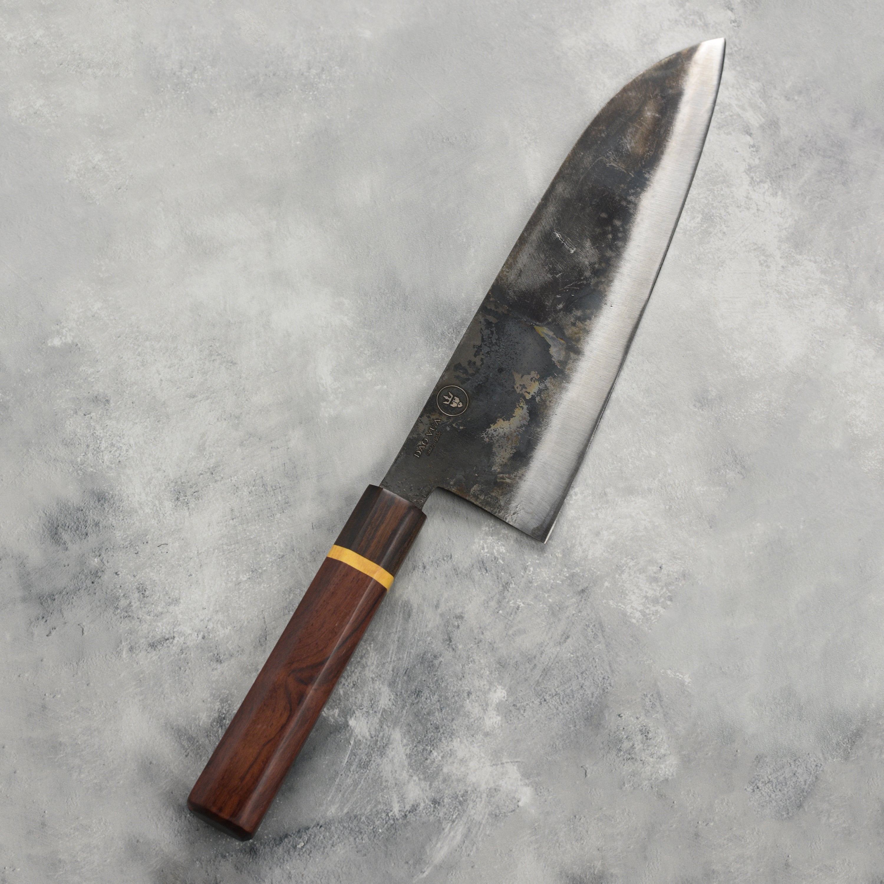 Dao Vua V3 gyuto knife showcasing sharp carbon steel blade and ergonomic handle.