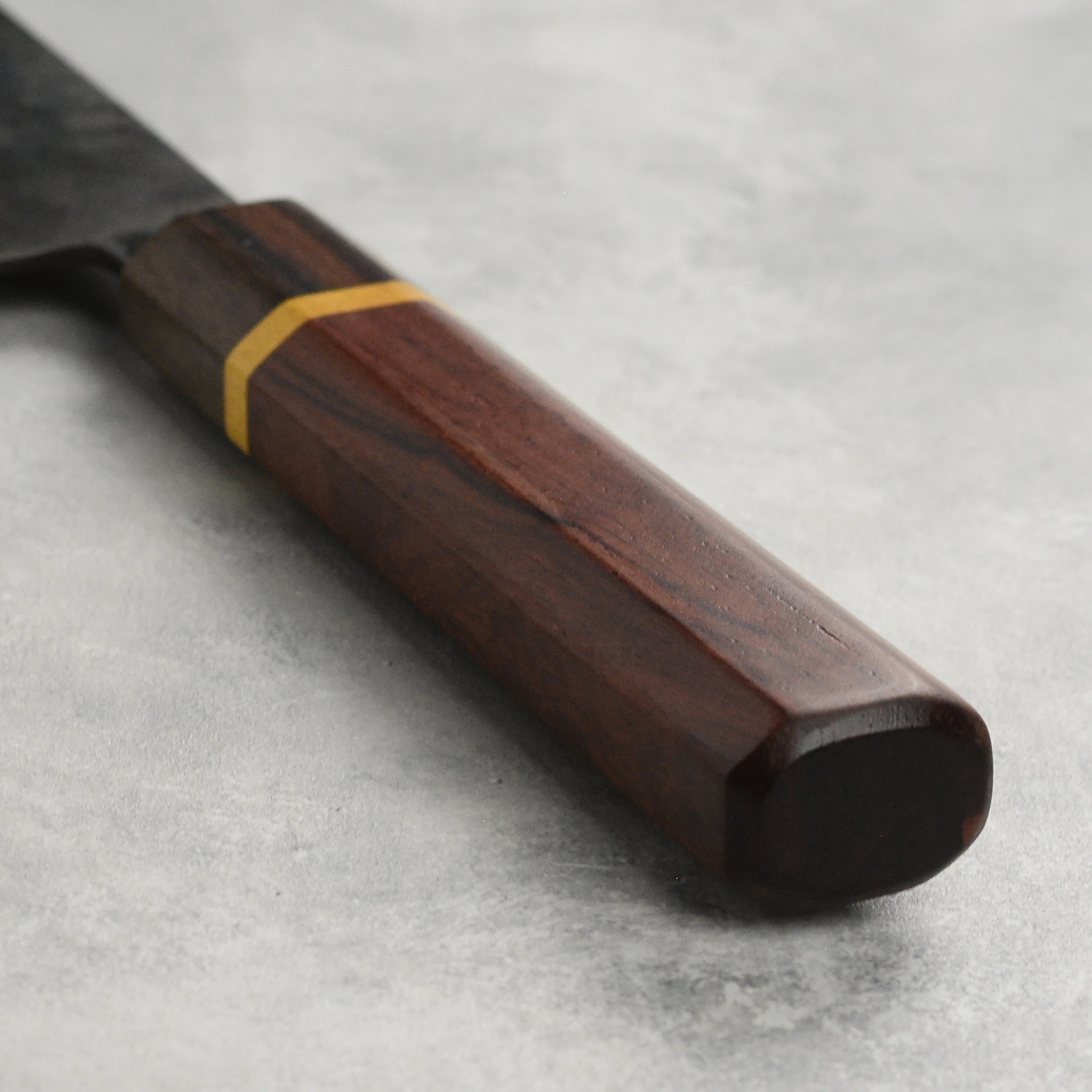 Professional chef using the Dao Vua V3 gyuto knife for precise slicing.