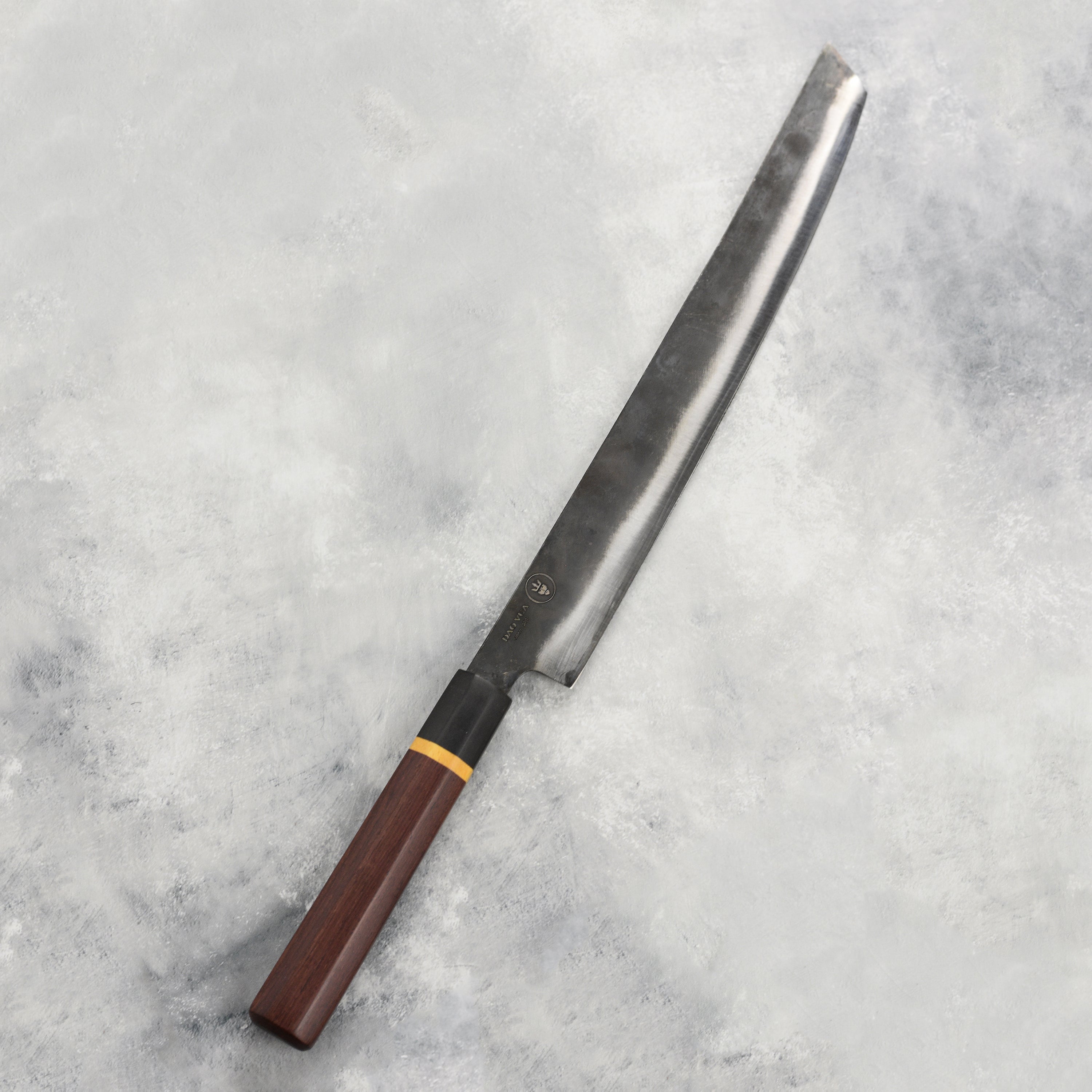Japanese Sakimaru slicer in use for slicing fish