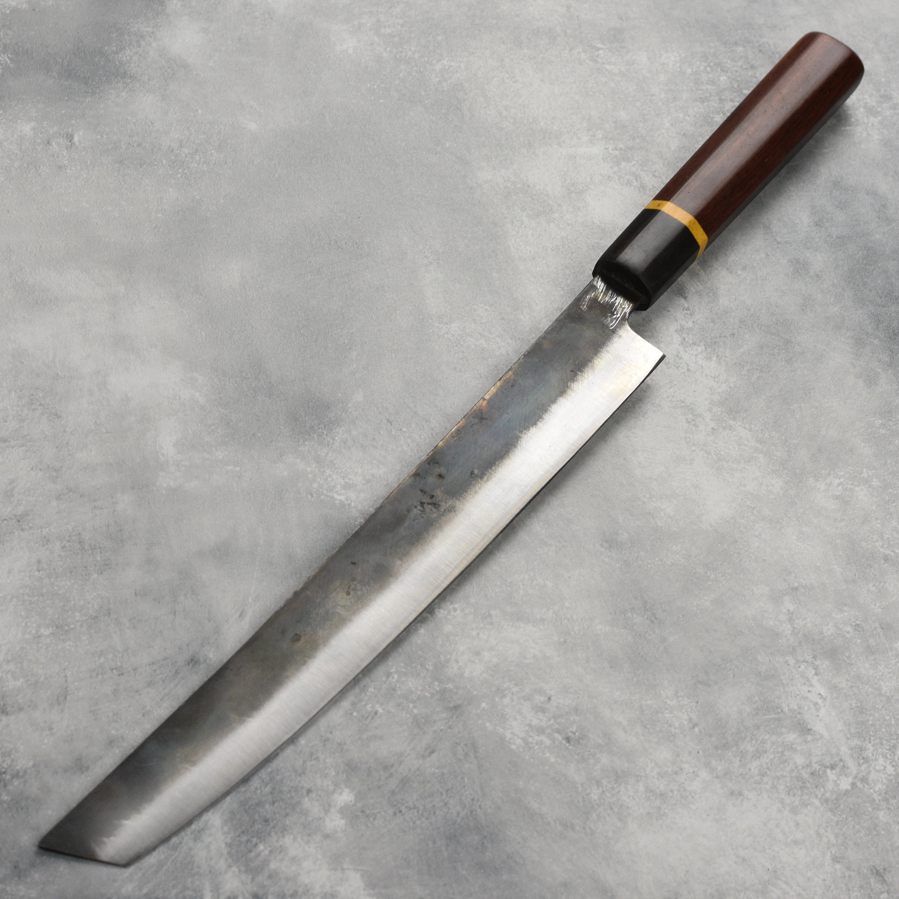 Close-up of a sharp carbon steel knife blade