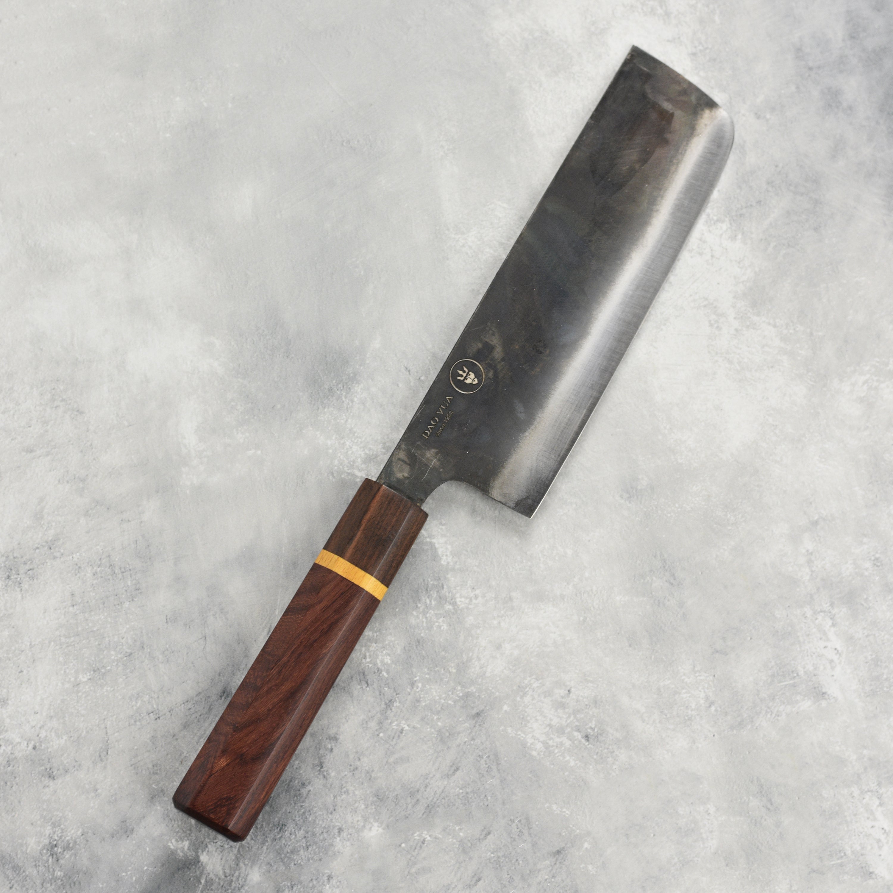 Dao Vua V3 Japanese nakiri knife with high-carbon steel blade and ergonomic handle for precision cutting