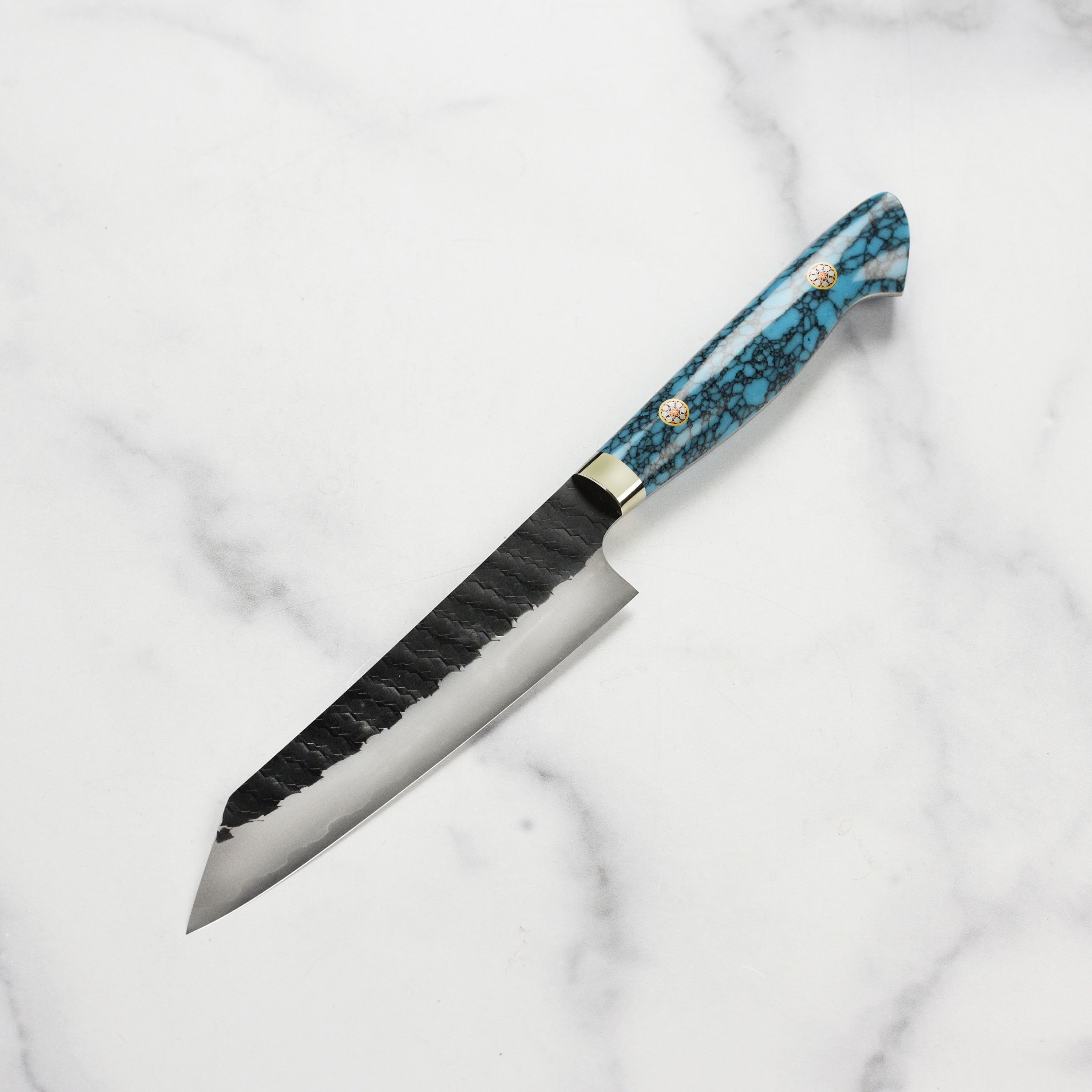 Japanese chef knife in use for slicing vegetables, showcasing precision and control
