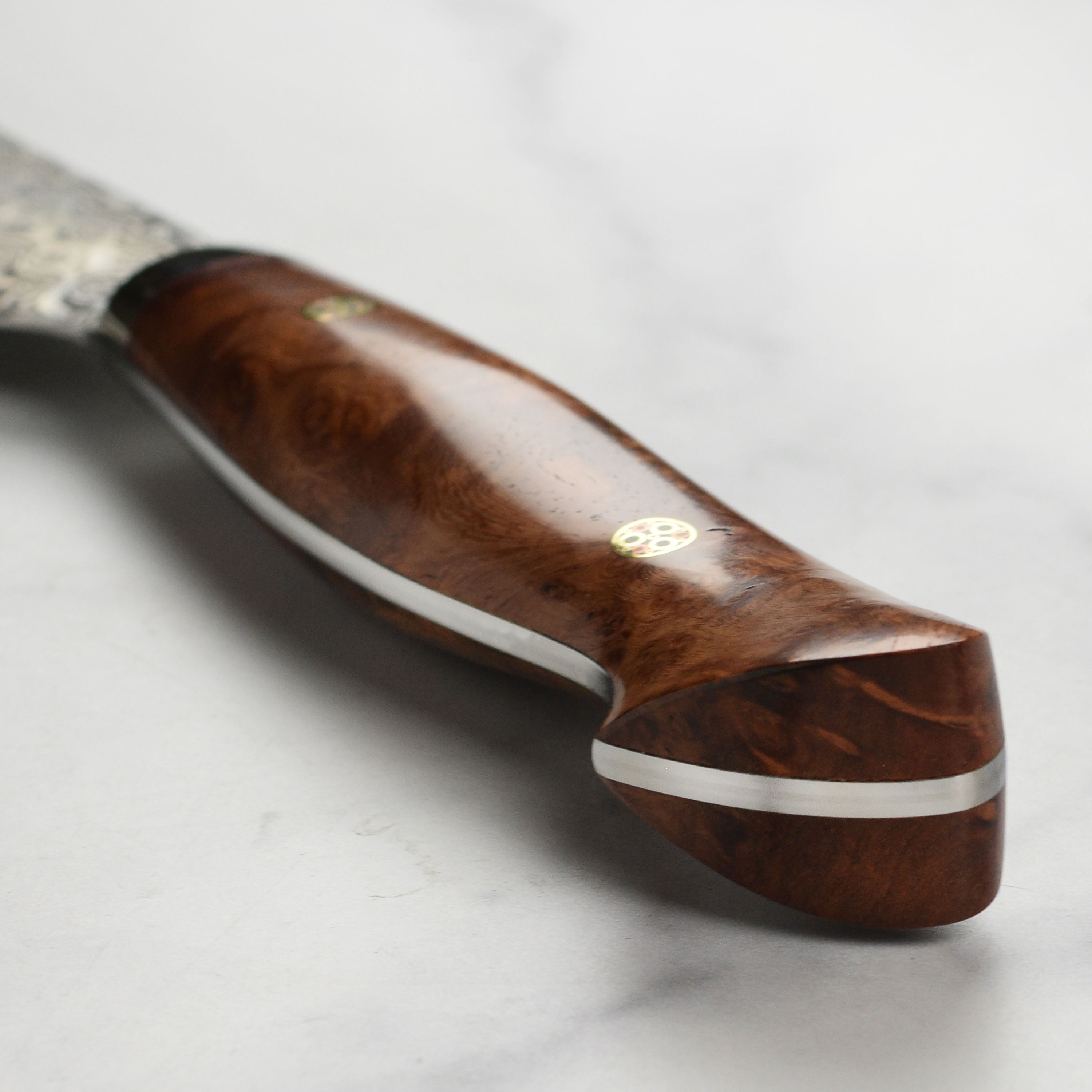 Detailed view of Damascus steel blade of Sakimaru sujihiki for precise slicing
