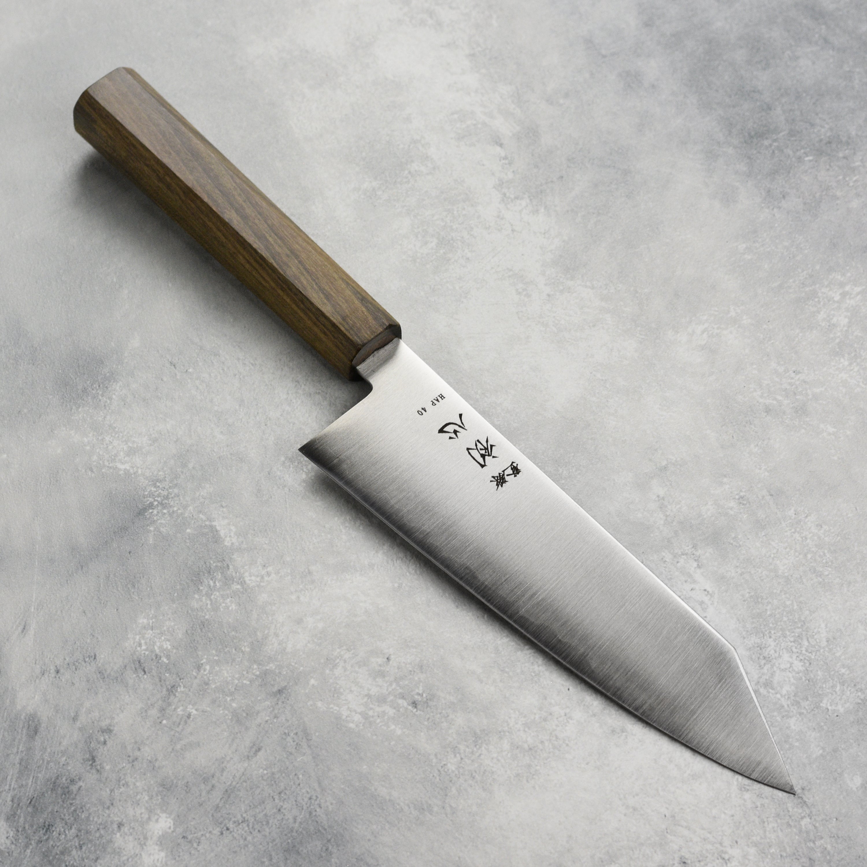 Hatsukokoro Hayabusa HAP40 bunka knife in a kitchen setting highlighting its sharp edge