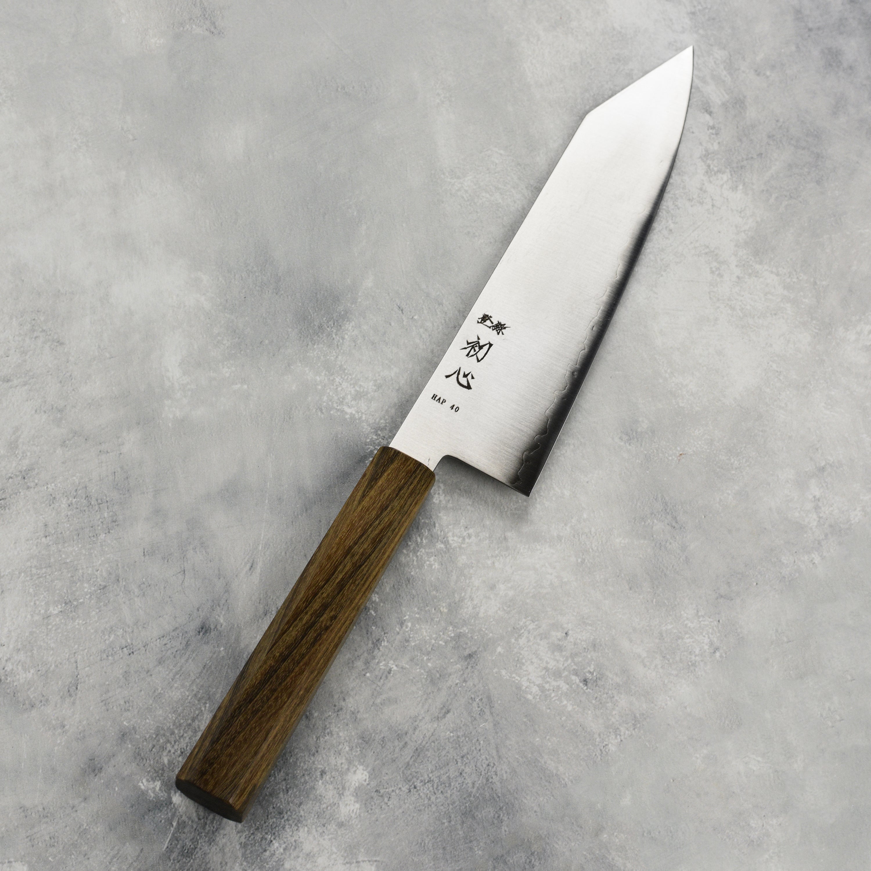 Detailed view of the 7-inch Japanese chef knife handle and blade