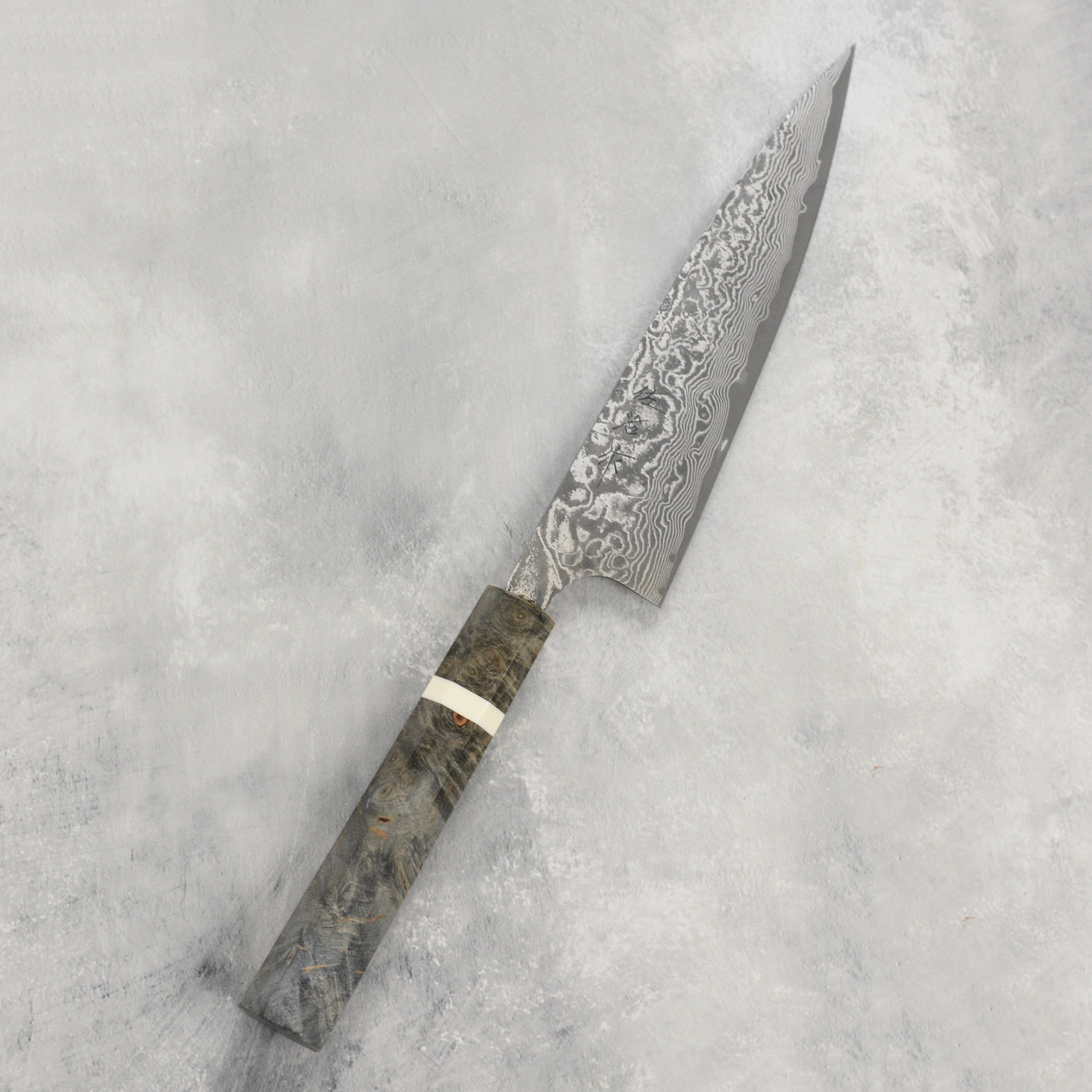 Saji Black Damascus Petty Knife - close-up of the blade and handle showing craftsmanship