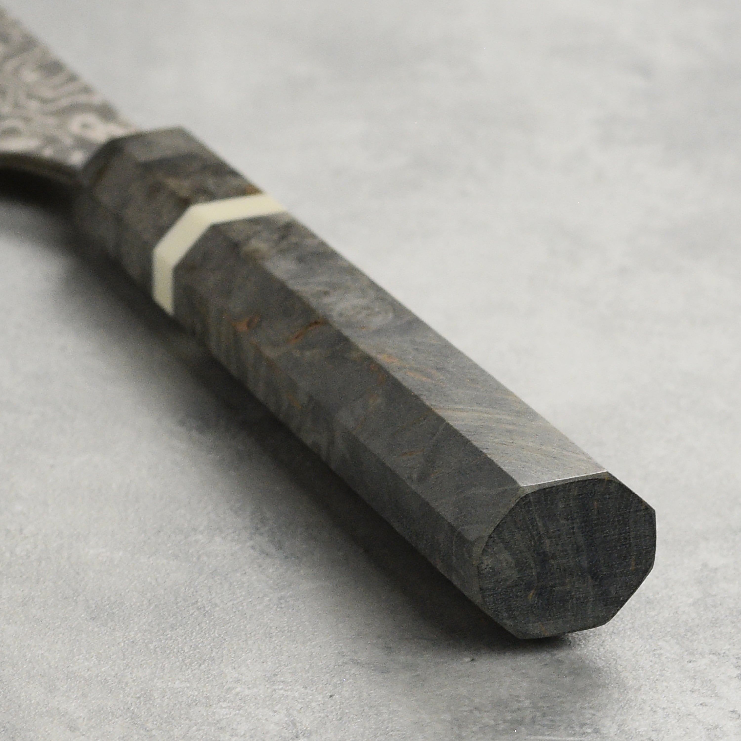 Saji Petty Knife in use, slicing vegetables for a gourmet meal
