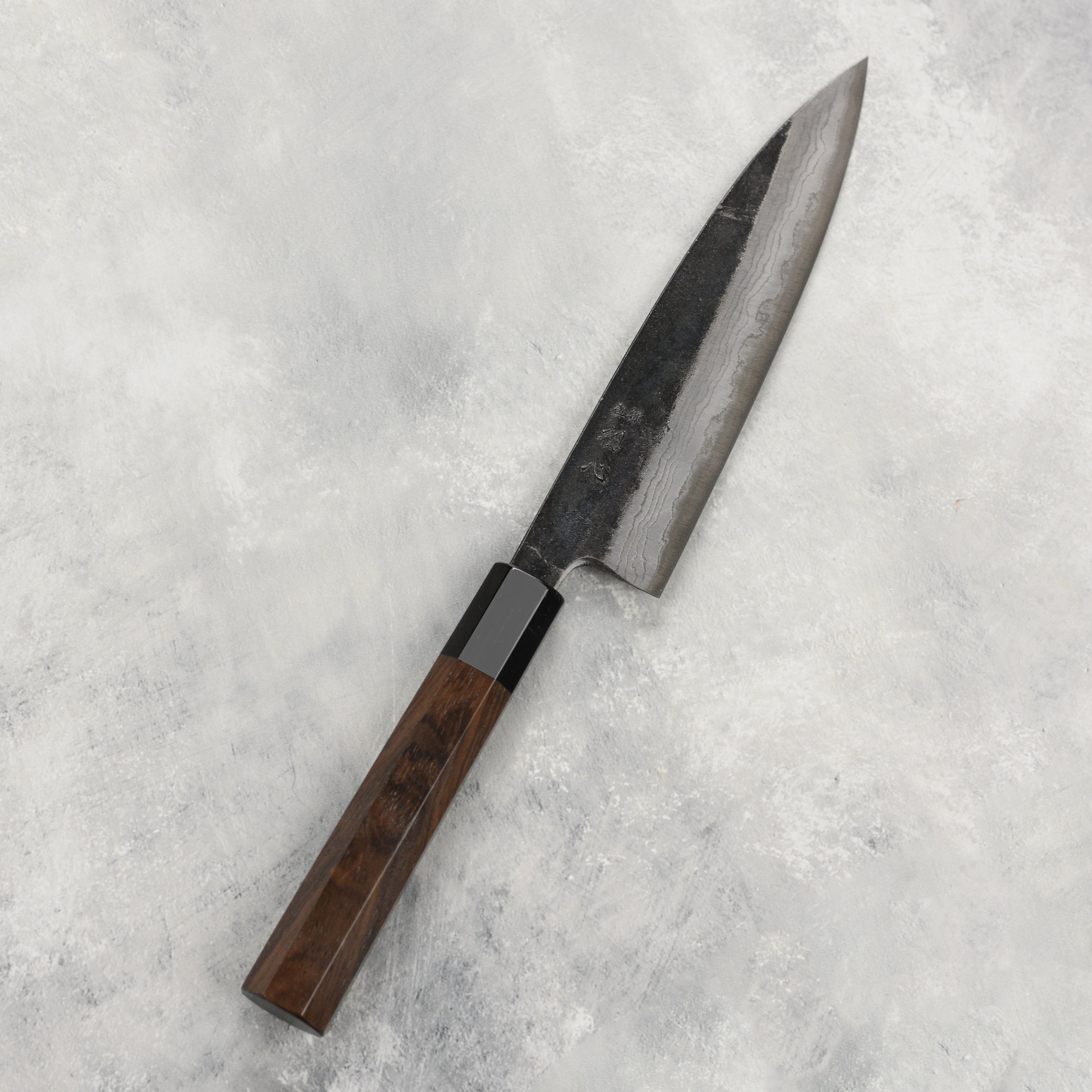 Hatsukokoro Premium Damascus Petty Knife from the side, highlighting the blades craftsmanship.