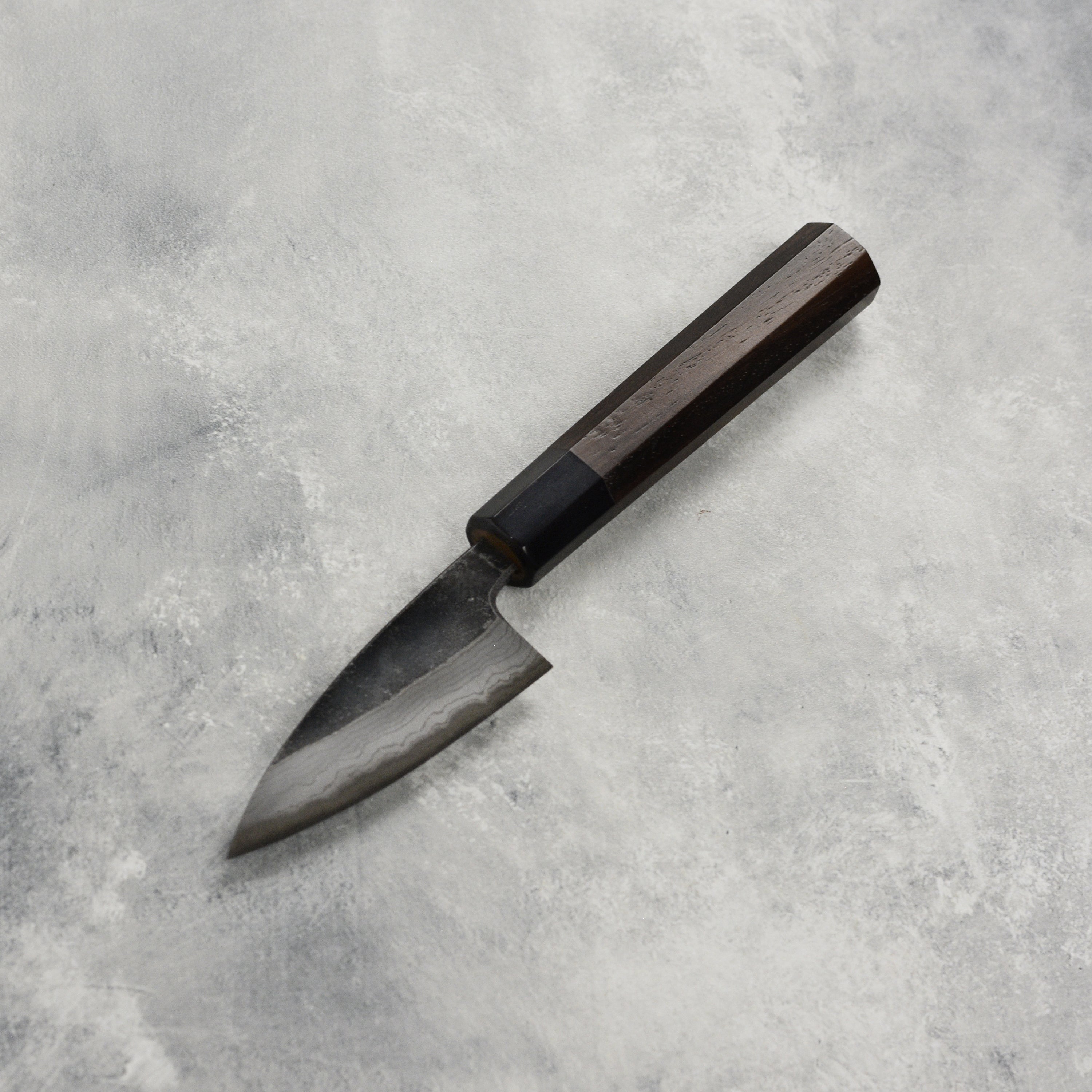 Detailed shot of the 3.1-inch blade showing high carbon steel construction
