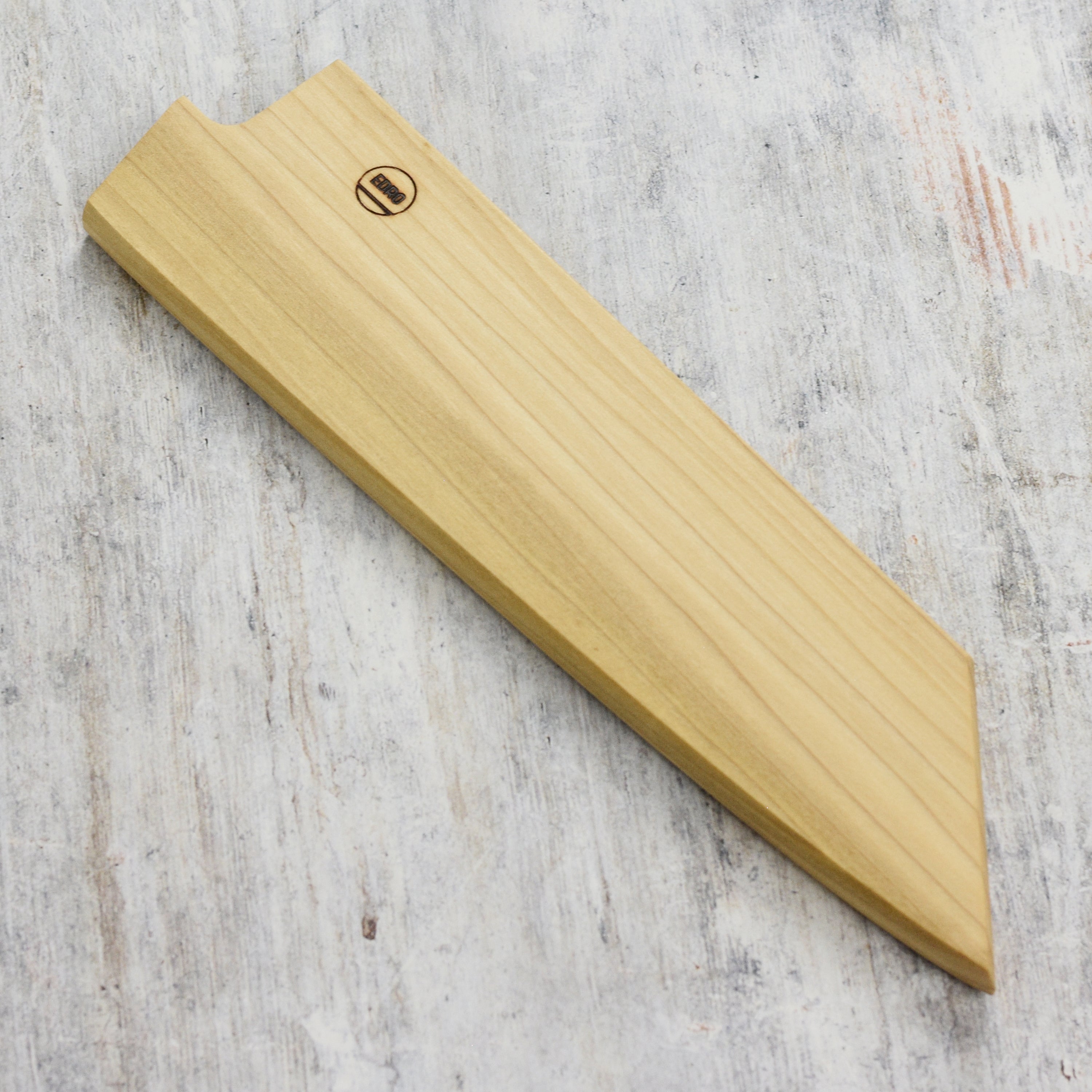 Top angle view of the kiritsuke knife sheath showing poplar wood grain and magnetic grip