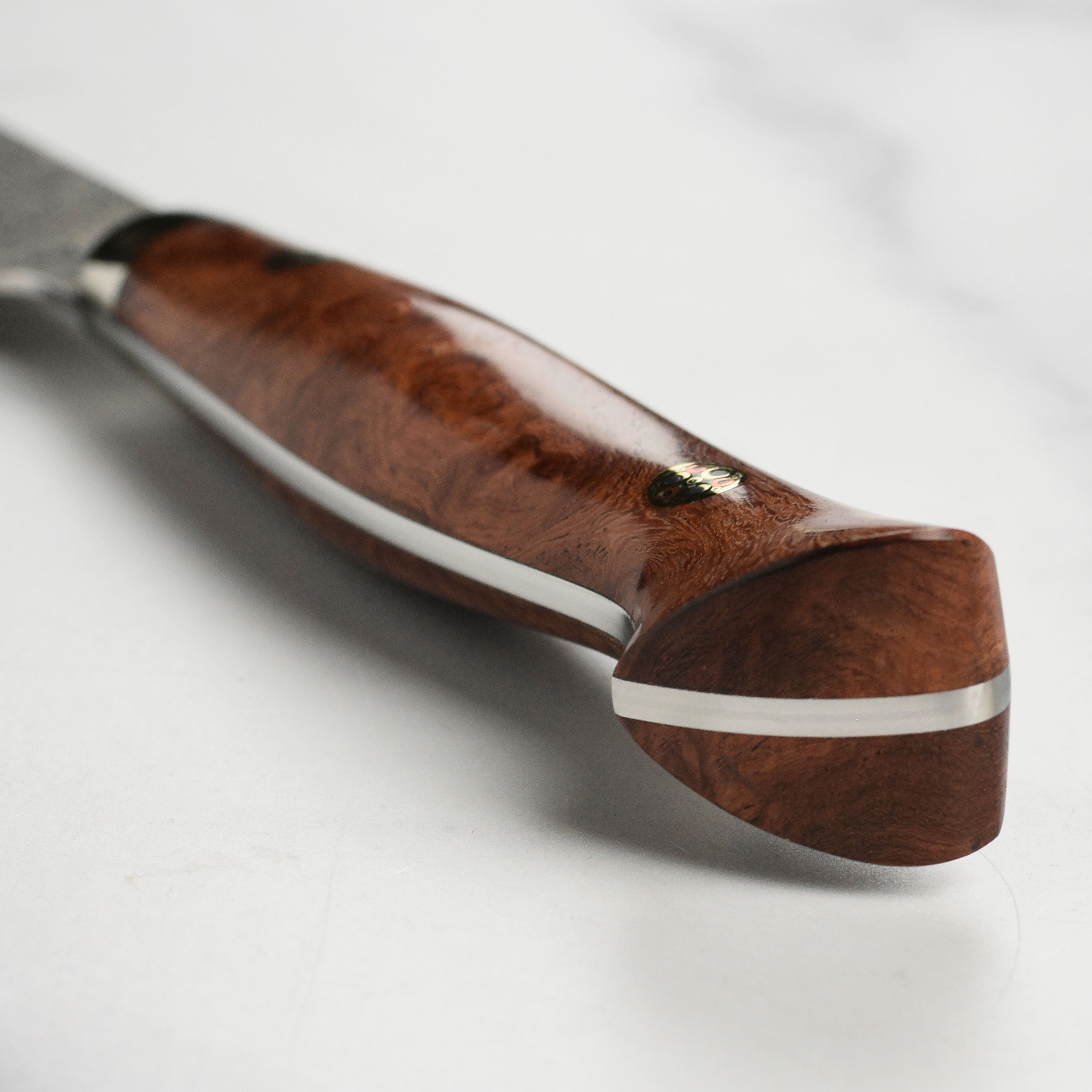 Detail shot of the Damascus steel blade showing intricate patterns for a Damascus knife