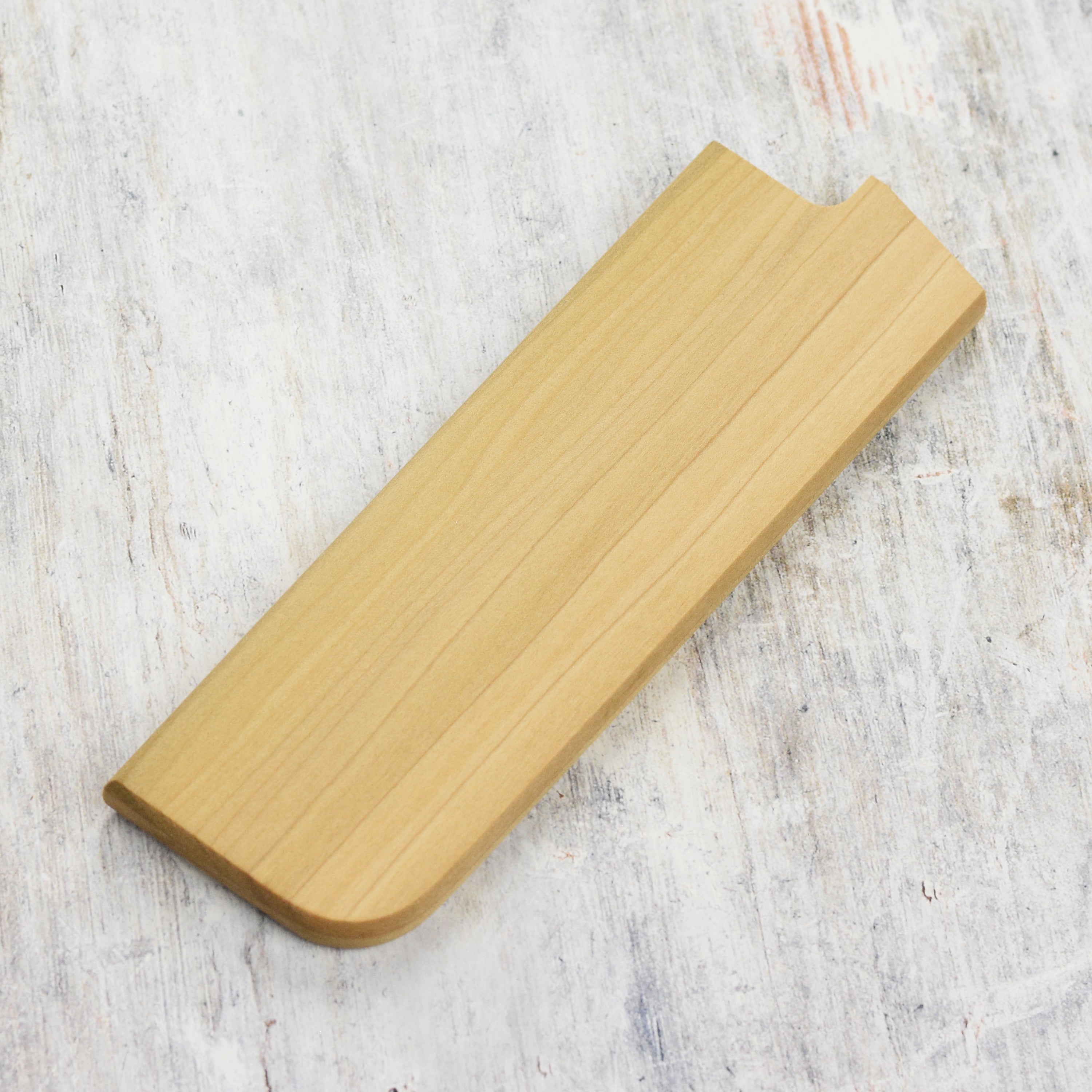 Close-up of the Edro magnetic saya holding a 6.5-inch Nakiri Japanese knife