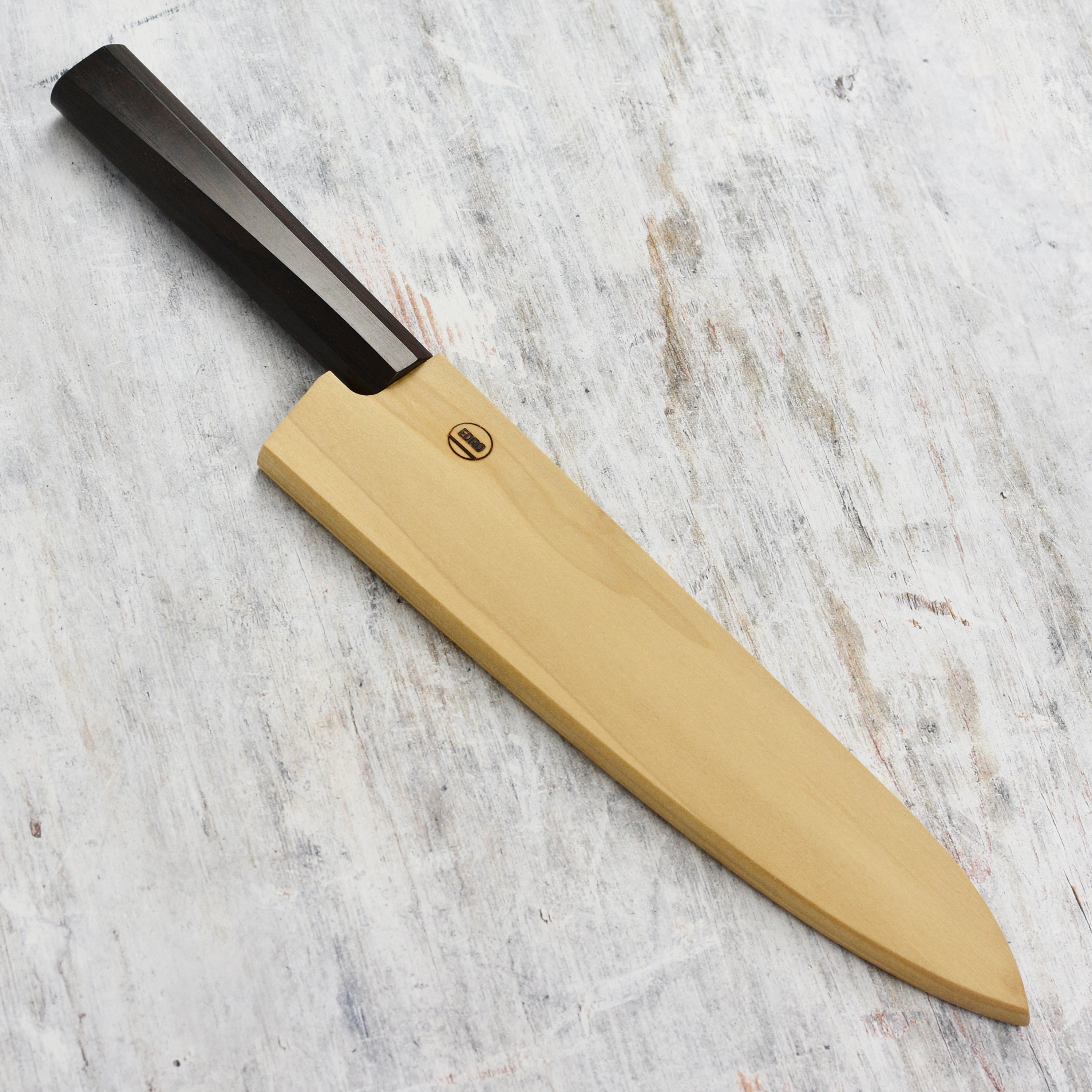 Close-up view of the magnetic knife holder, showing the sturdy yellow poplar wood and smooth finish.
