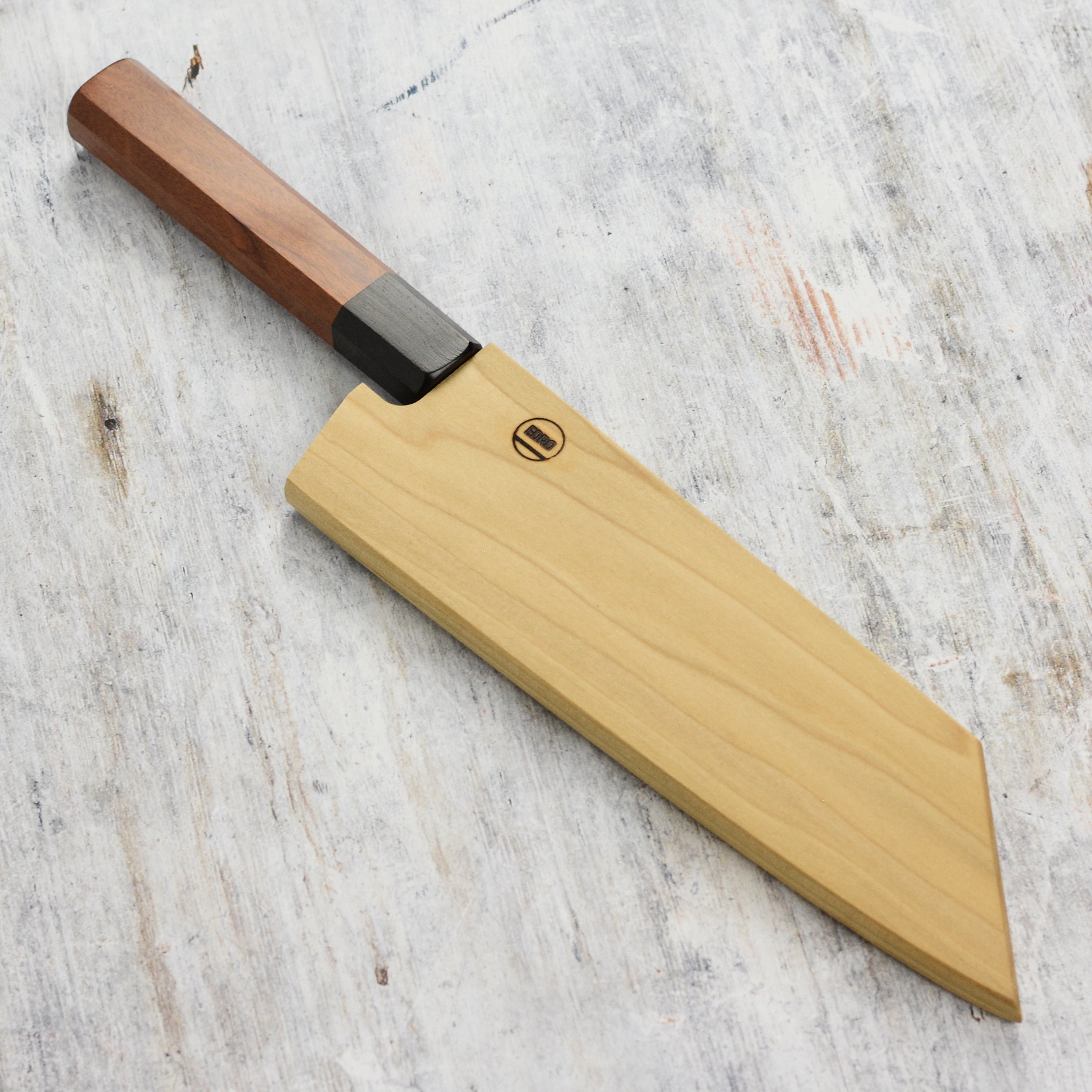 Angled side photo highlighting the poplar wood grain of the knife sheath