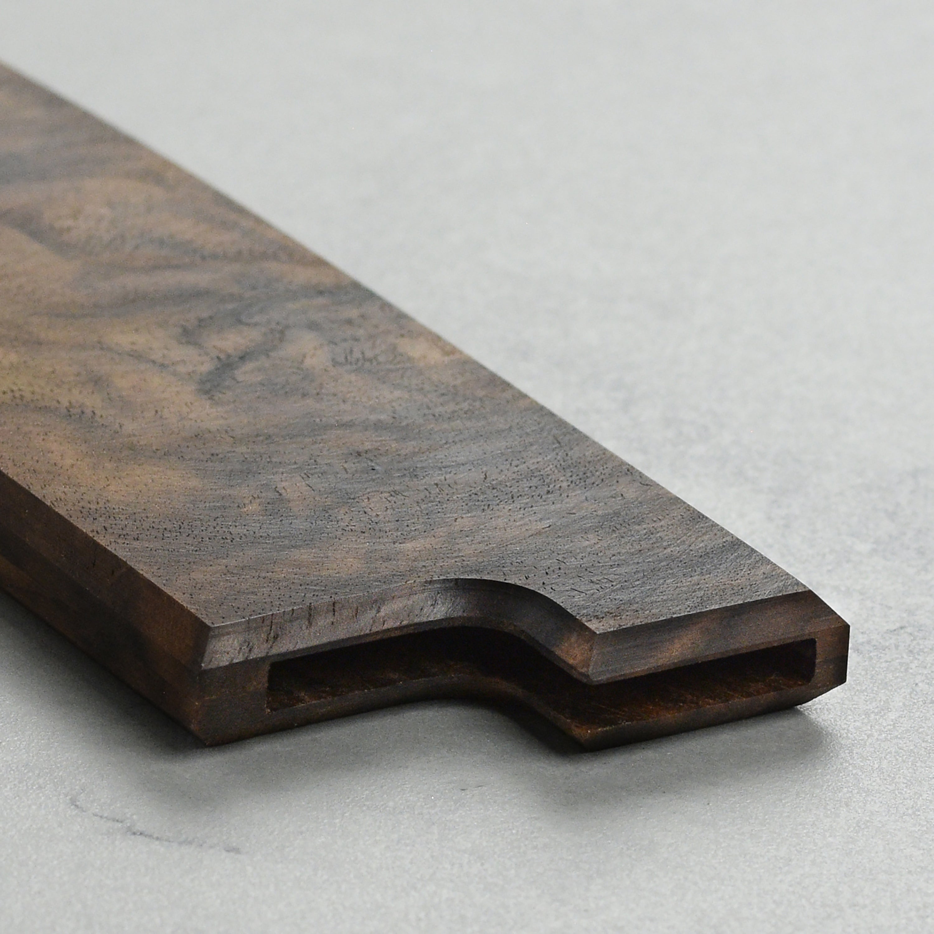 Angled side view of handcrafted gyuto cover made in USA lying flat on chef’s counter