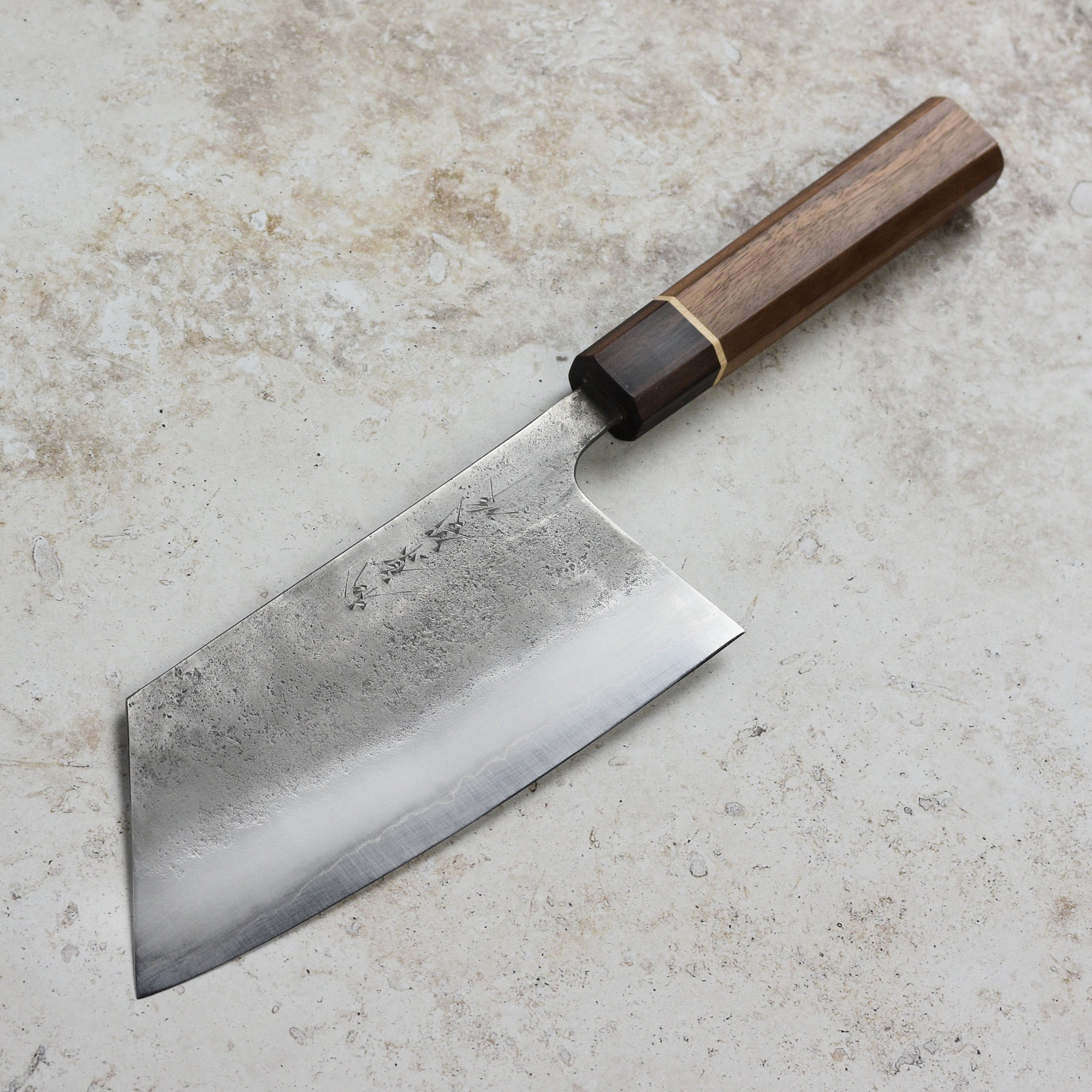 Close-up of the Matsubara Aogami cleaver blade highlighting its sharp edge and stainless steel finish.