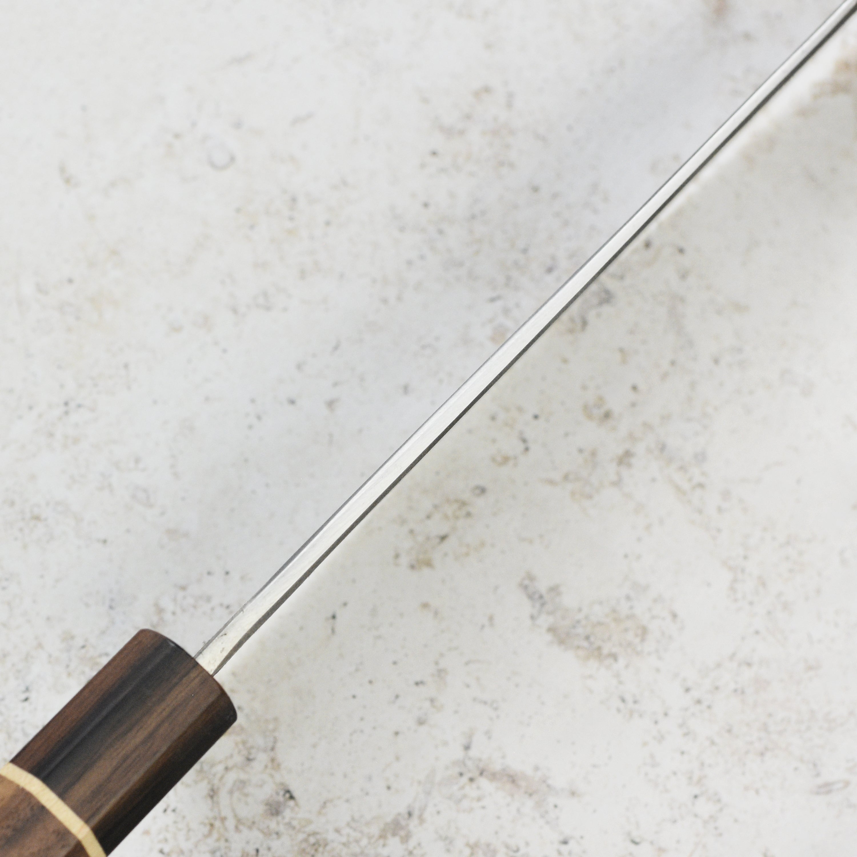 Side view of the Matsubara Aogami cleaver displaying its ergonomic handle and beautiful Nashiji pattern.