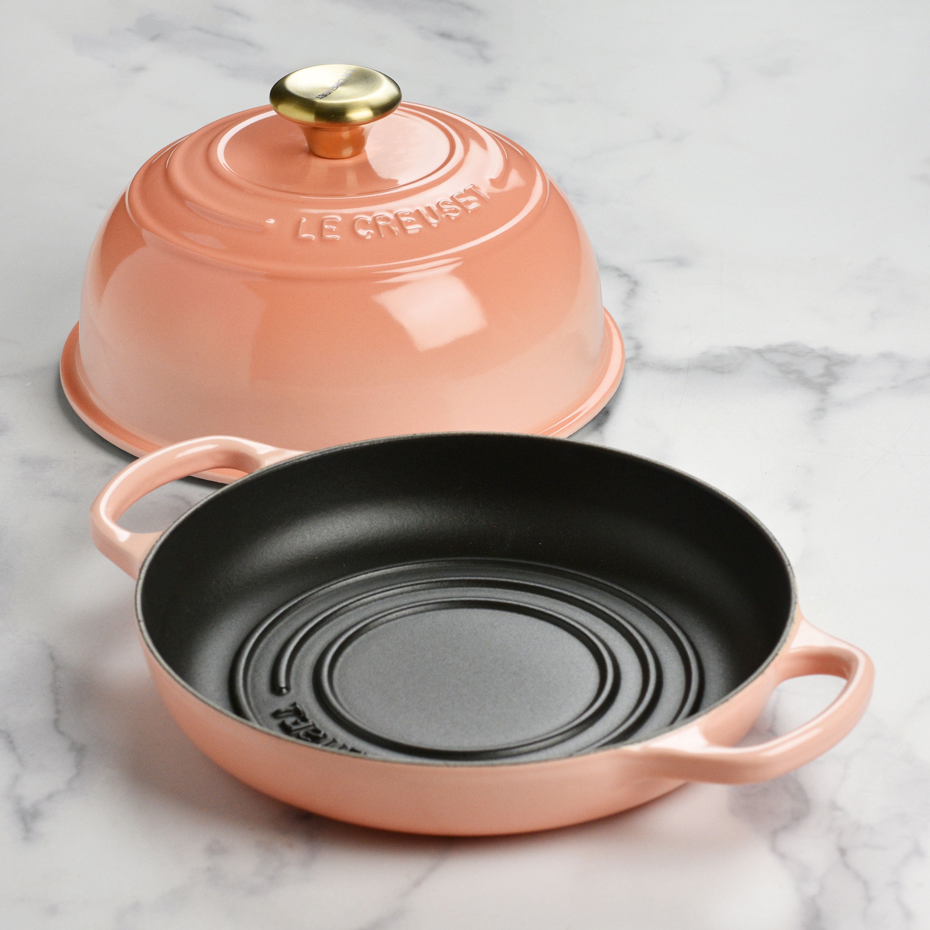 Bread baking in a Le Creuset cast iron oven, showcasing even crust and rise