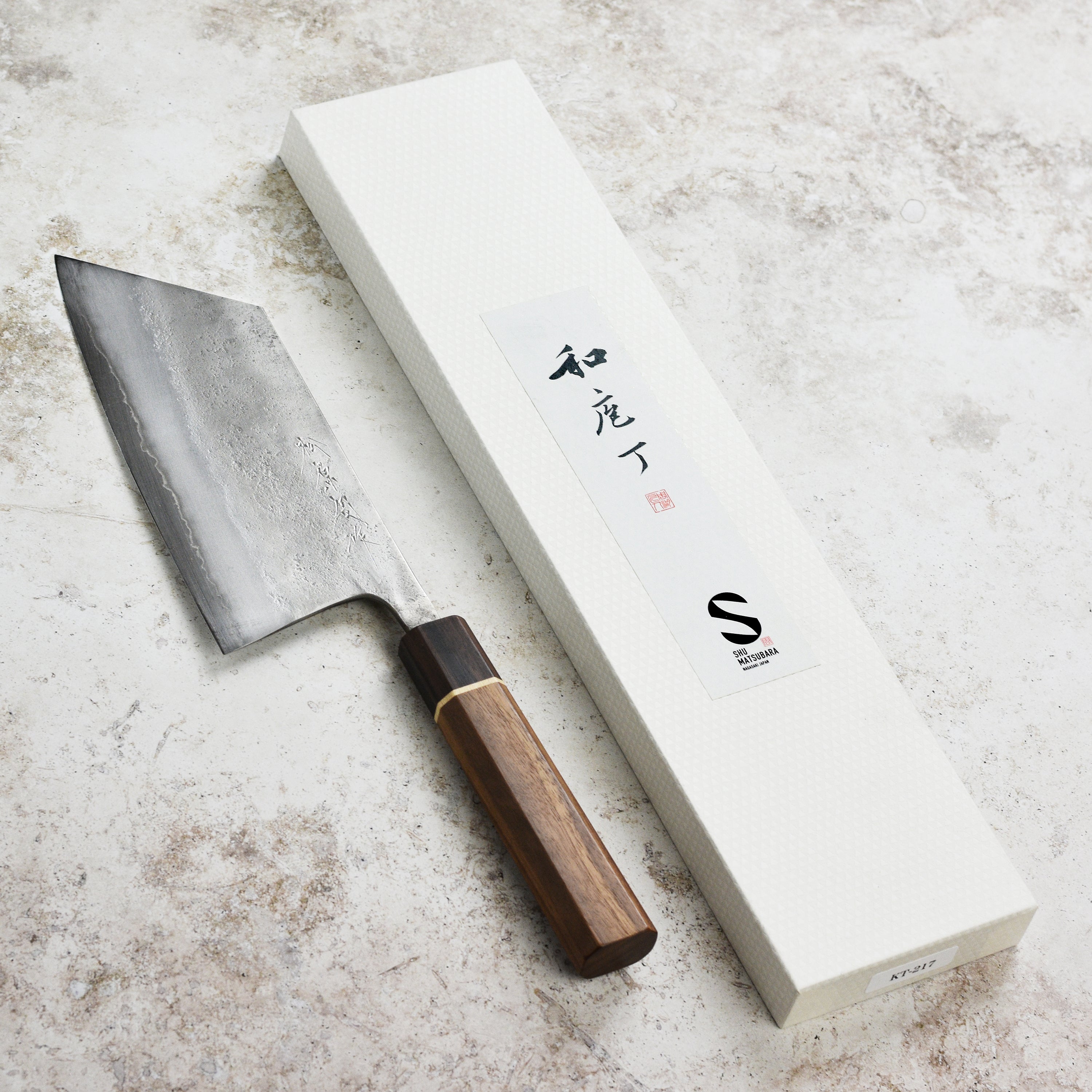 Close-up of the Matsubara Aogami cleaver blade highlighting its sharp edge and stainless steel finish.