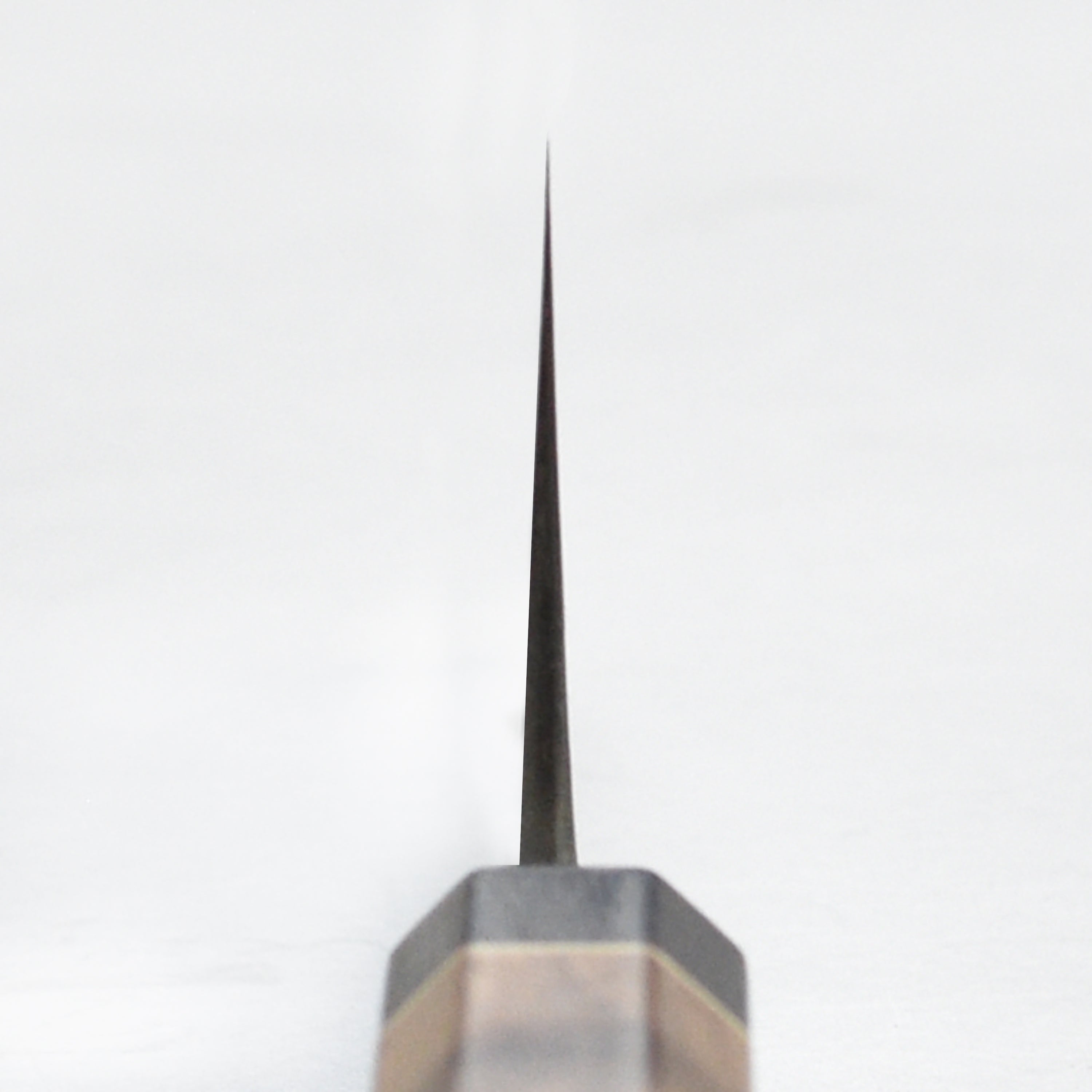 Matsubara Nakiri knife on a wooden cutting board, highlighting its stainless steel finish.