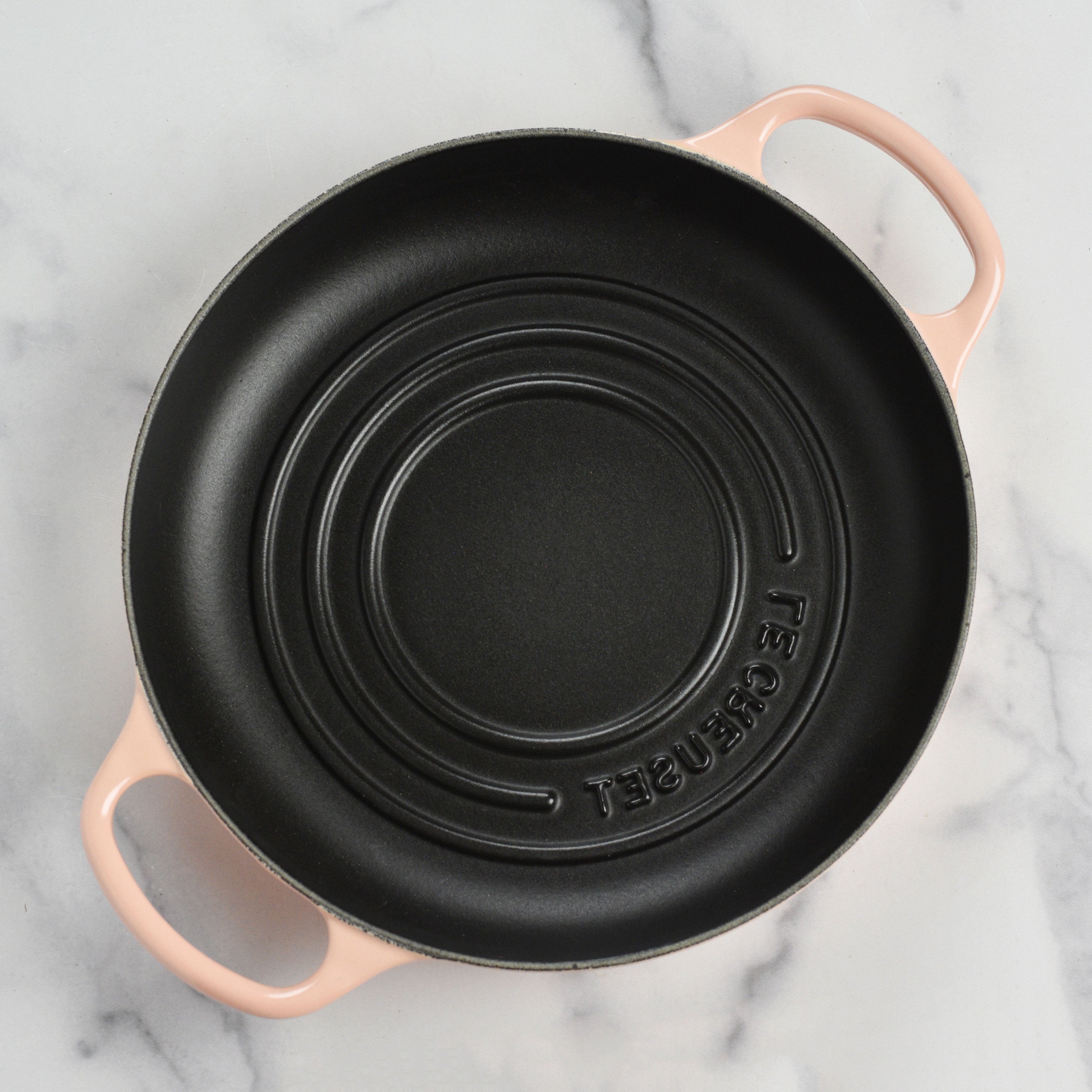 Le Creuset cast iron bread oven with lid on a kitchen counter, ideal for bread baking