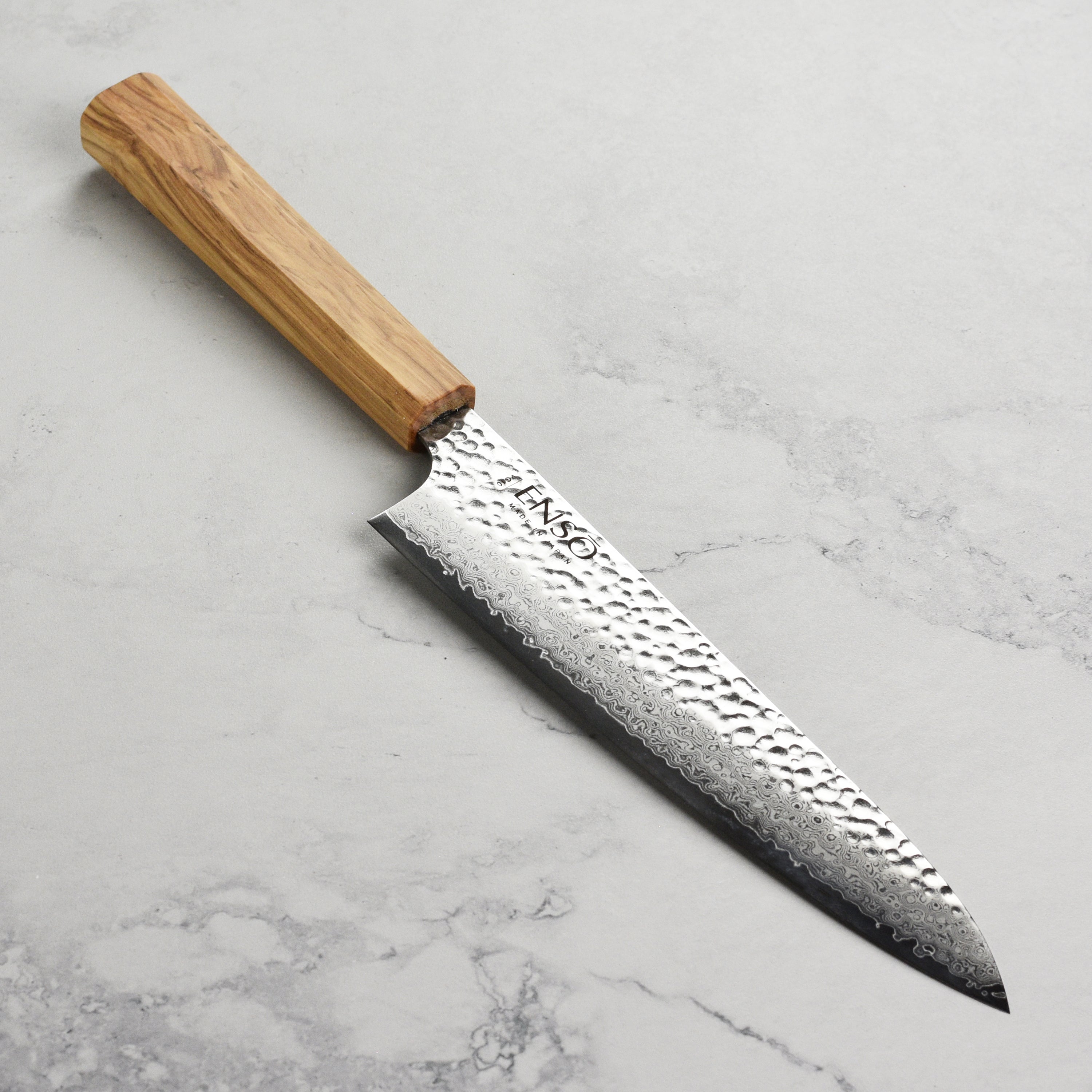Enso Olivewood 8.25 inch gyuto knife showing sharp blade edge and polished handle