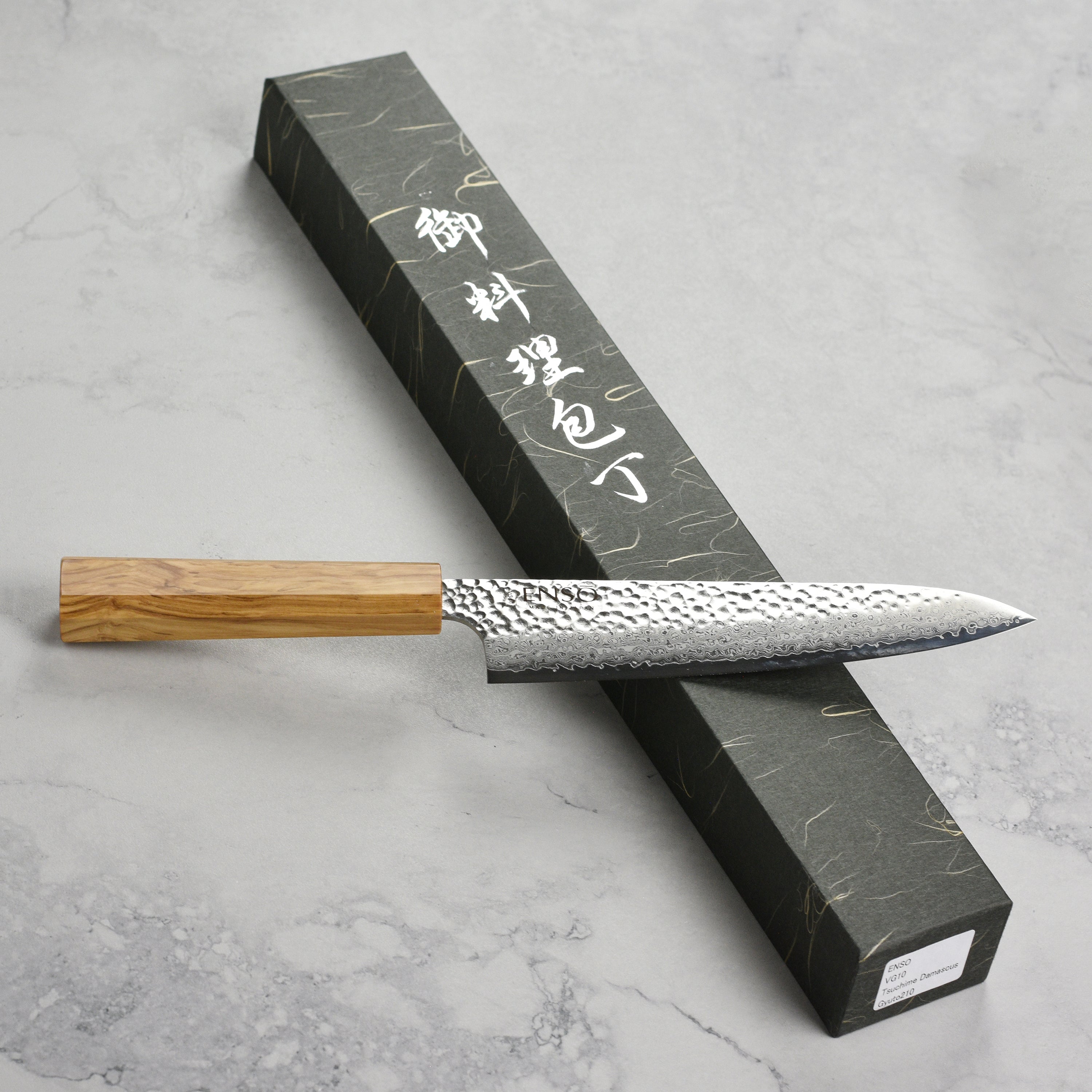 Enso Olivewood 8.25 inch gyuto knife showing sharp blade edge and polished handle