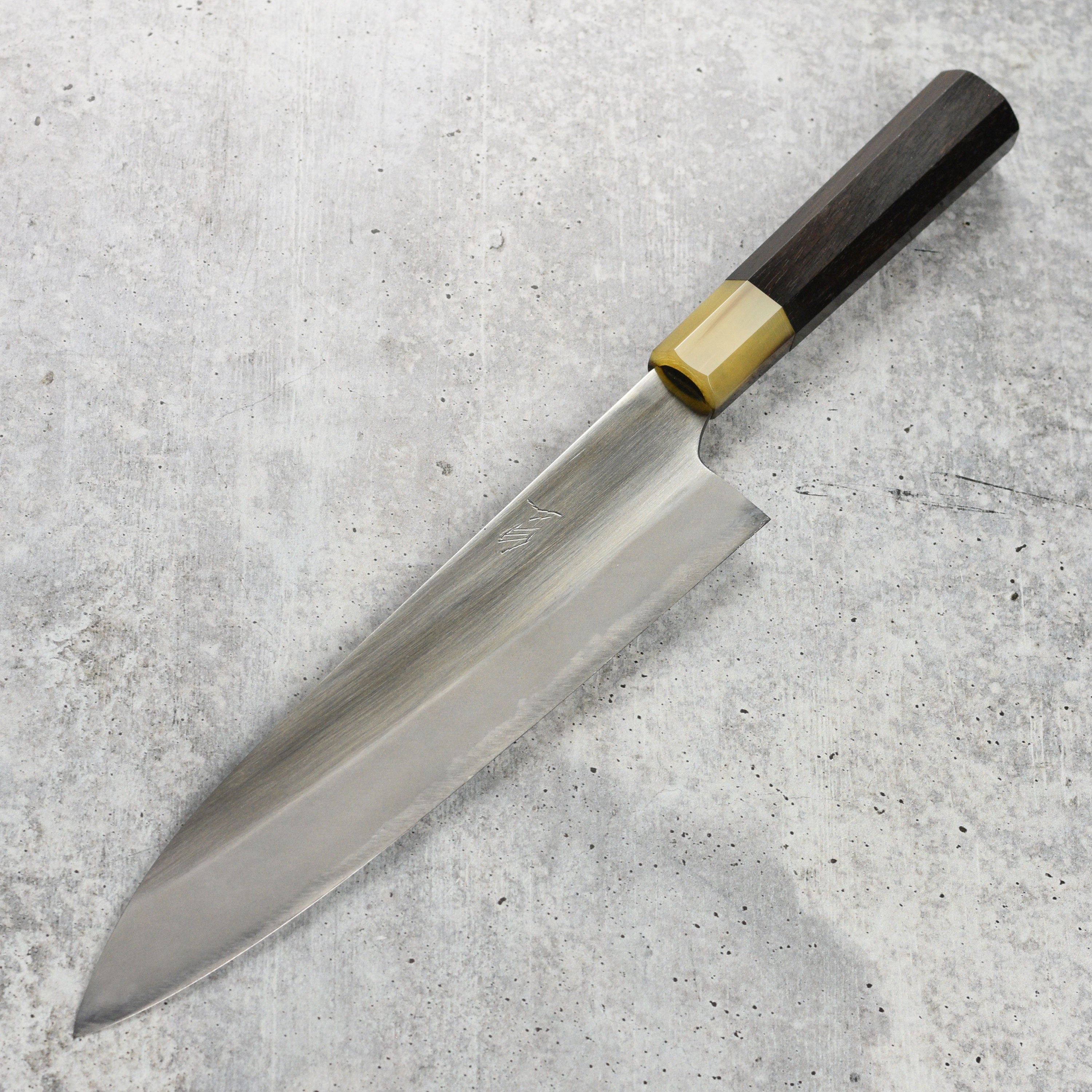 Close-up of the sharp edge of the Japanese chef knife showing craftsmanship