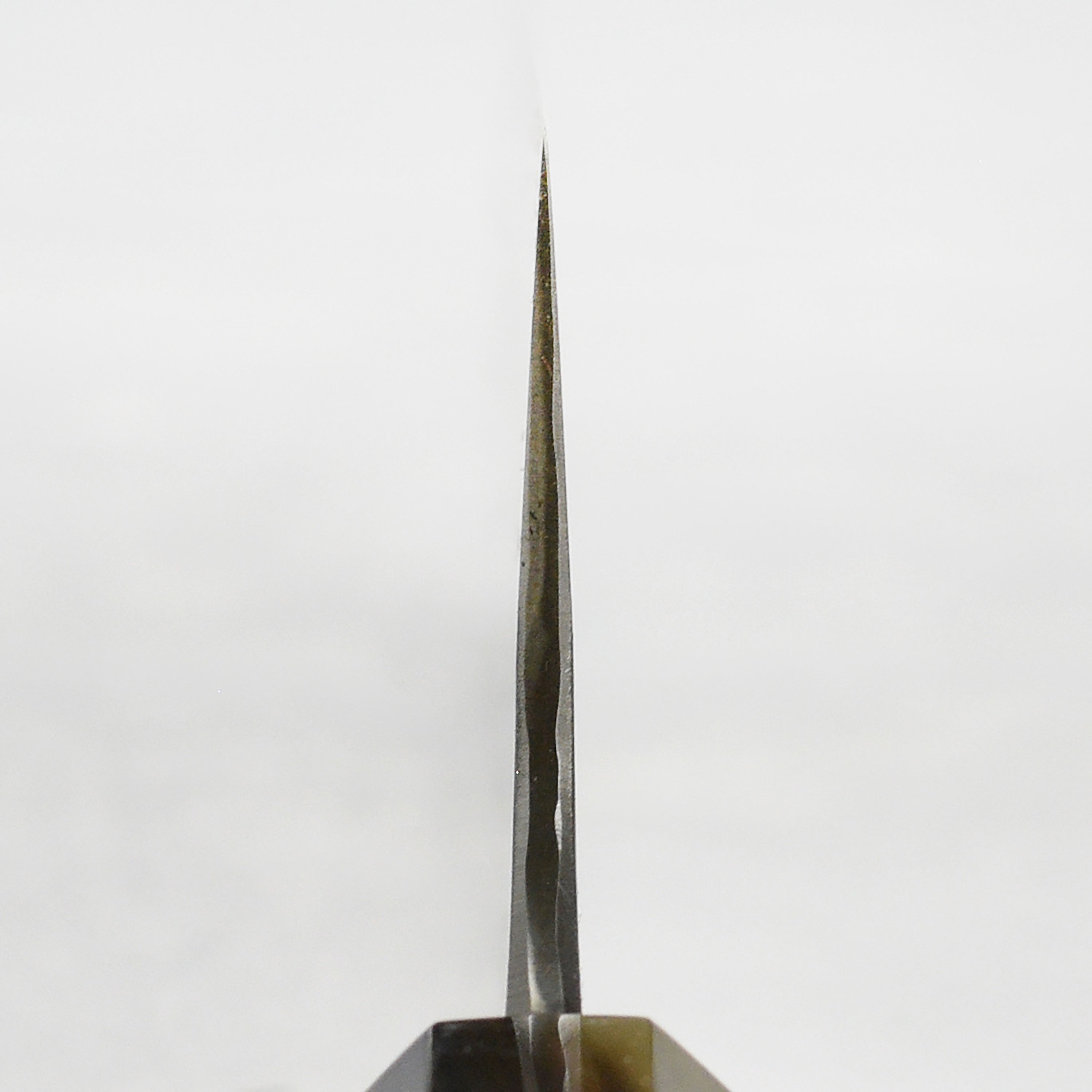 Close-up of the sharp edge of the Japanese chef knife showing craftsmanship