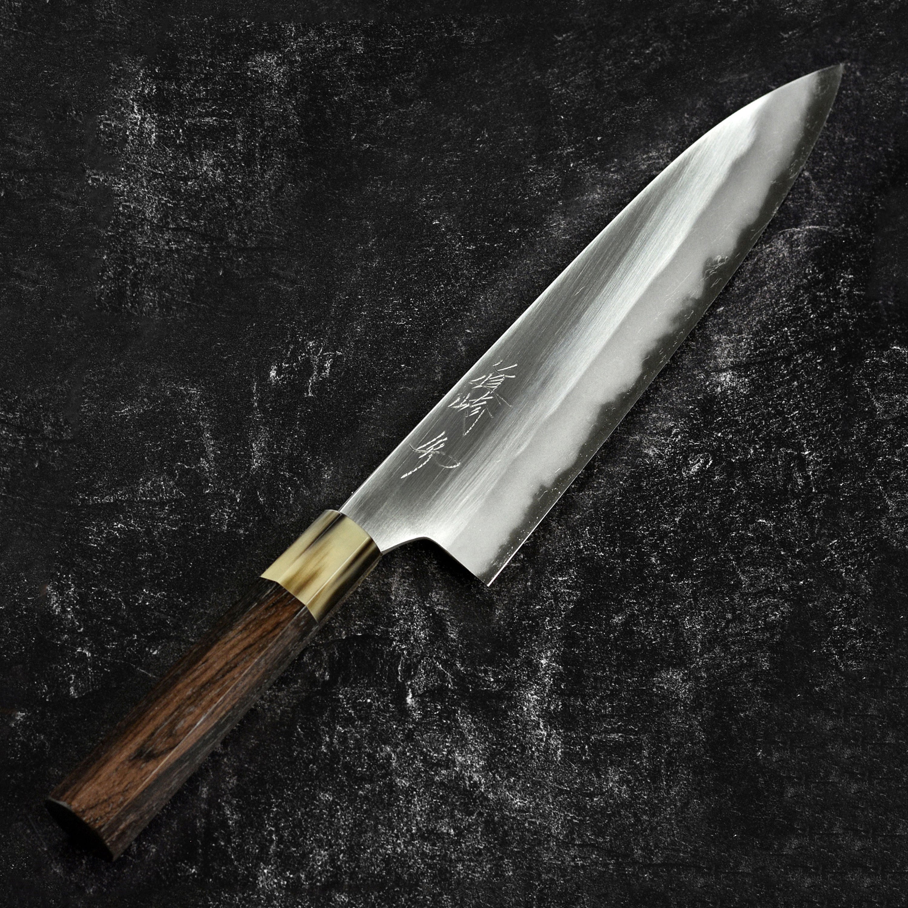 Close-up of the sharp edge of the Japanese chef knife showing craftsmanship