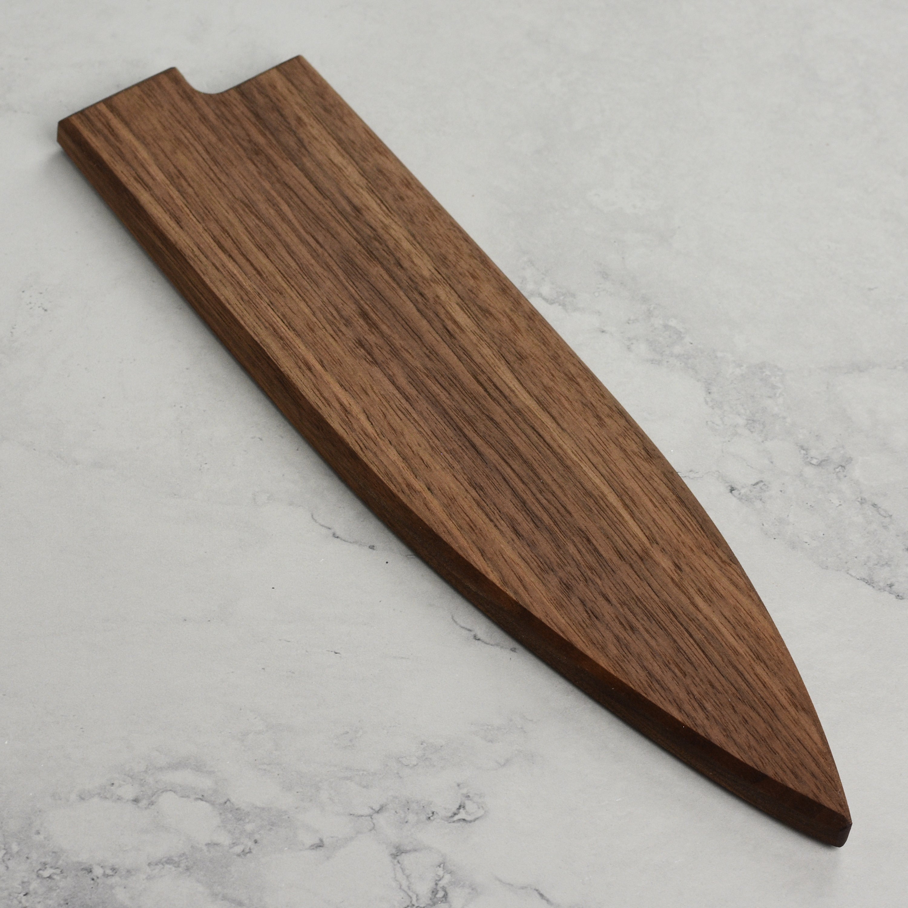 Handcrafted walnut magnetic saya for gyuto knives, showing the natural wood grain and magnetic closure
