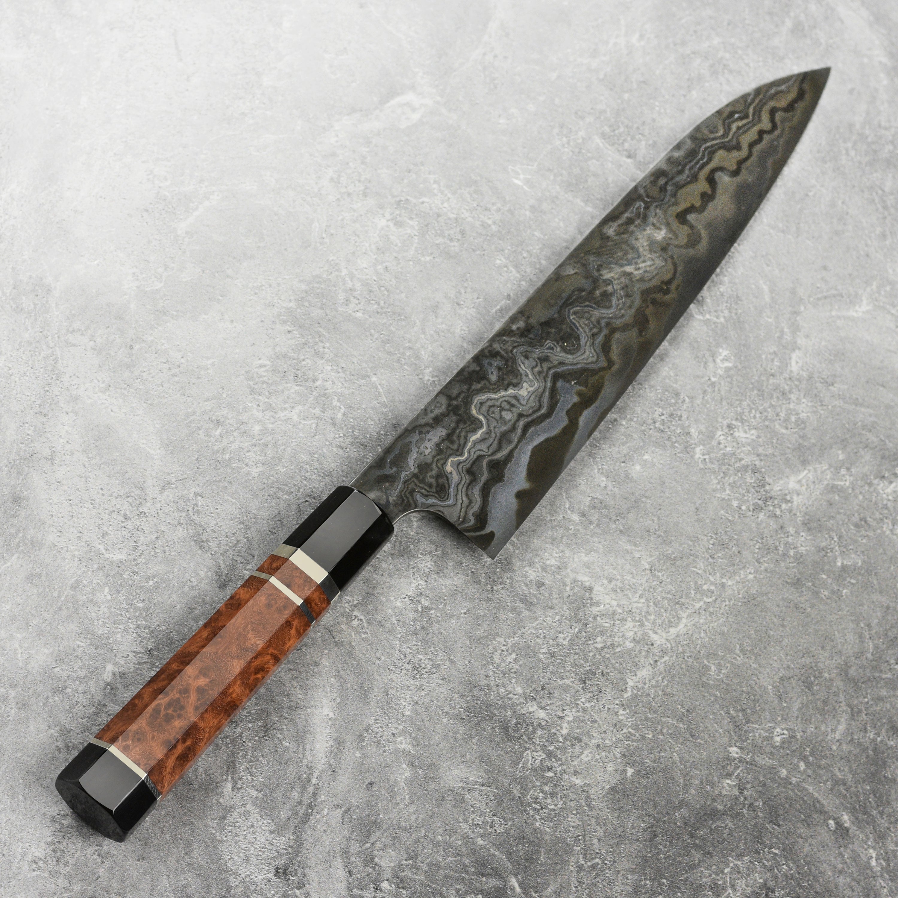 Handle and spine detail of the coreless Damascus Gyuto, highlighting craftsmanship and balance
