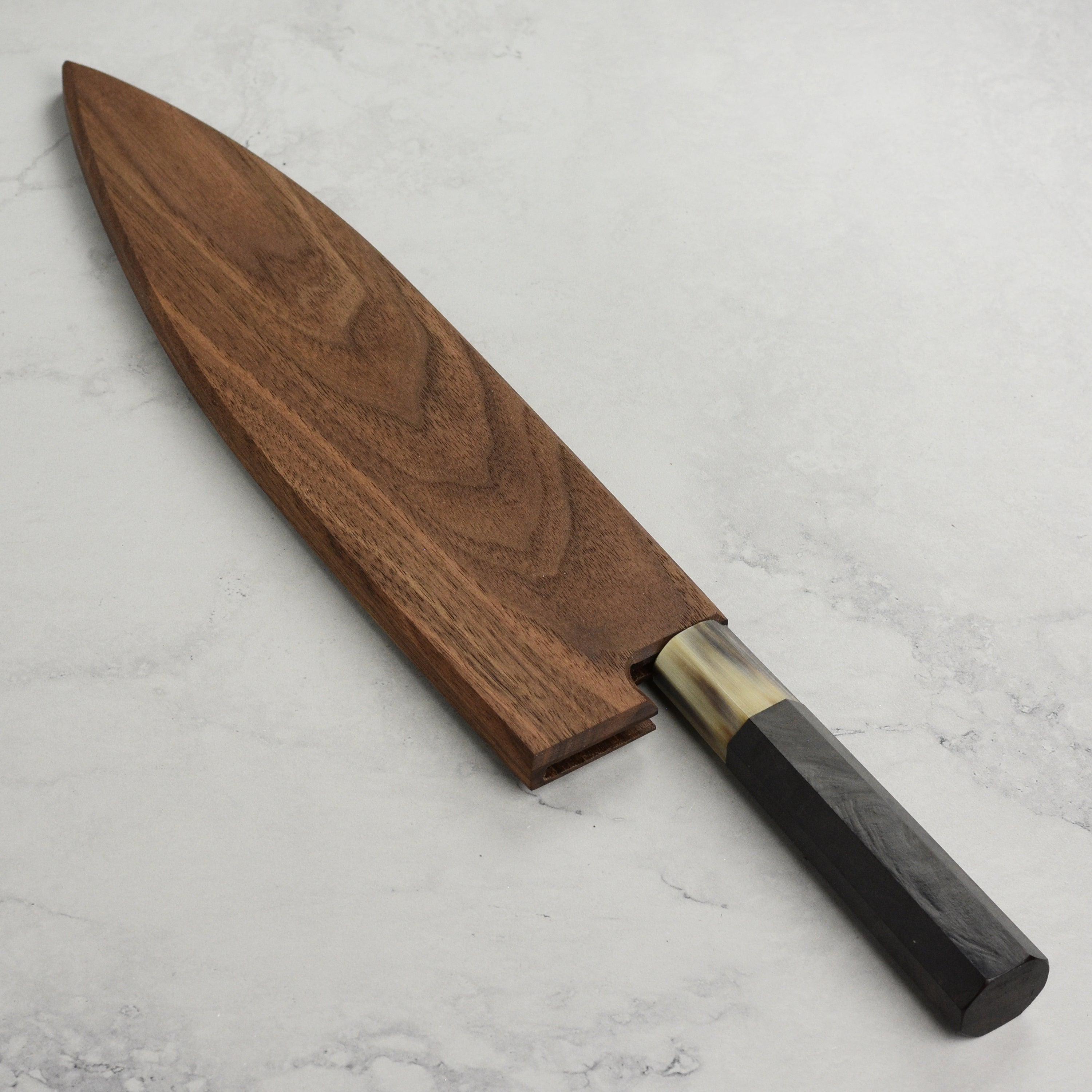 Handcrafted walnut magnetic saya for gyuto knives, showing the natural wood grain and magnetic closure