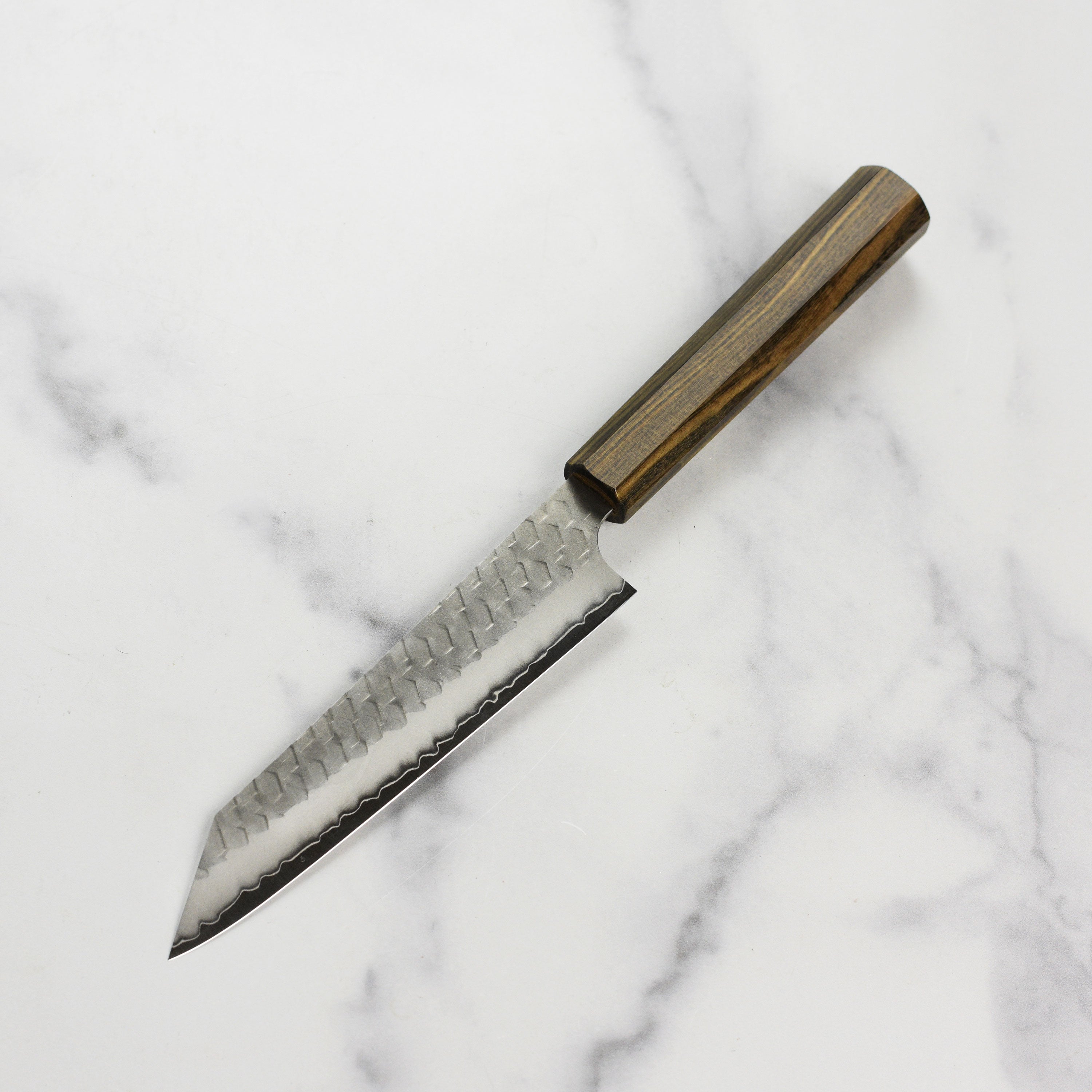 Detail shot of the Tsuchime finish on the Japanese Kiritsuke chef knife