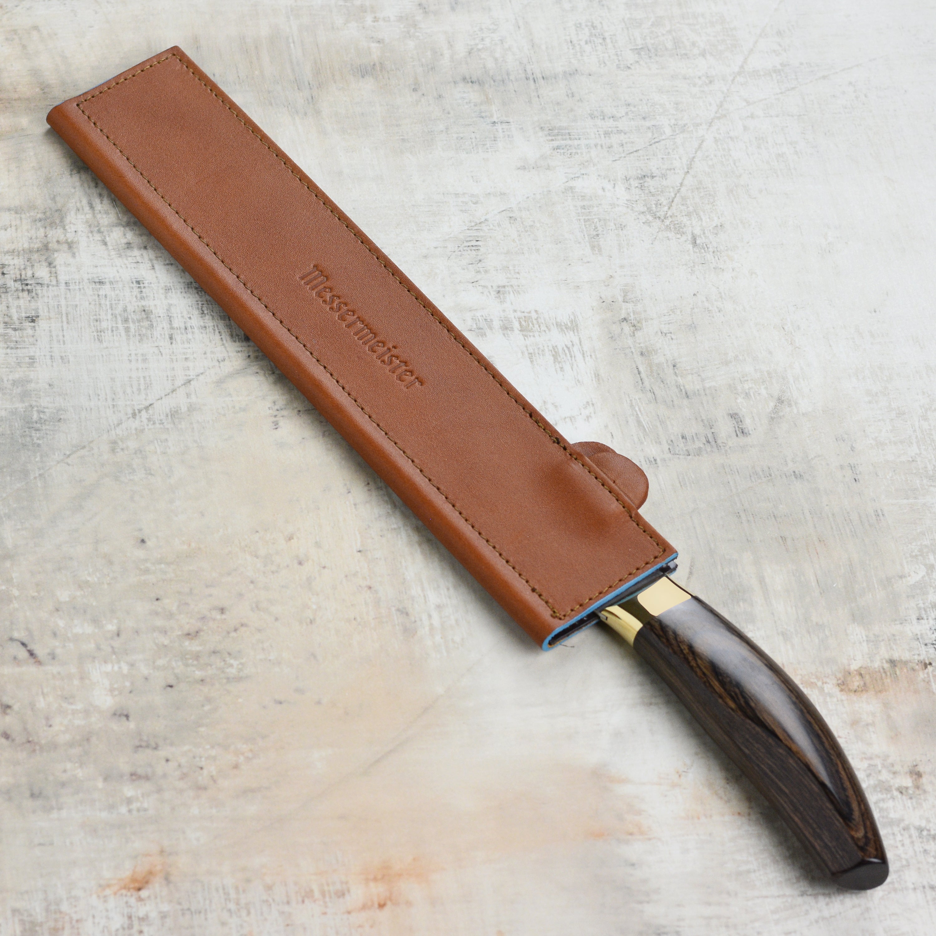 Open leather sheath showing magnetic interior and 10.5-inch knife fit