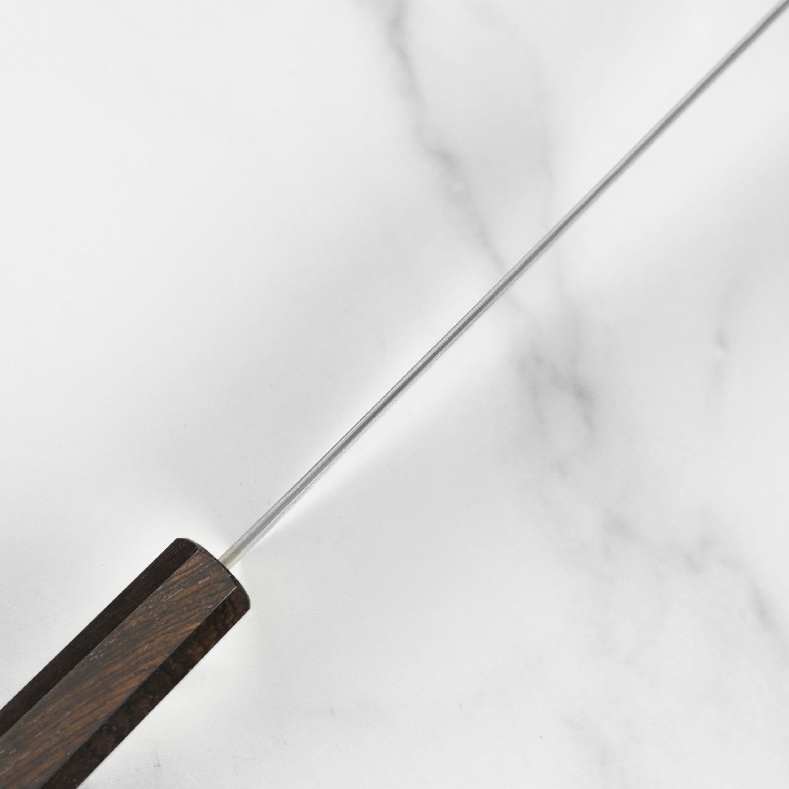 Close-up of the handle and blade of the Japanese chef knife for precision cutting
